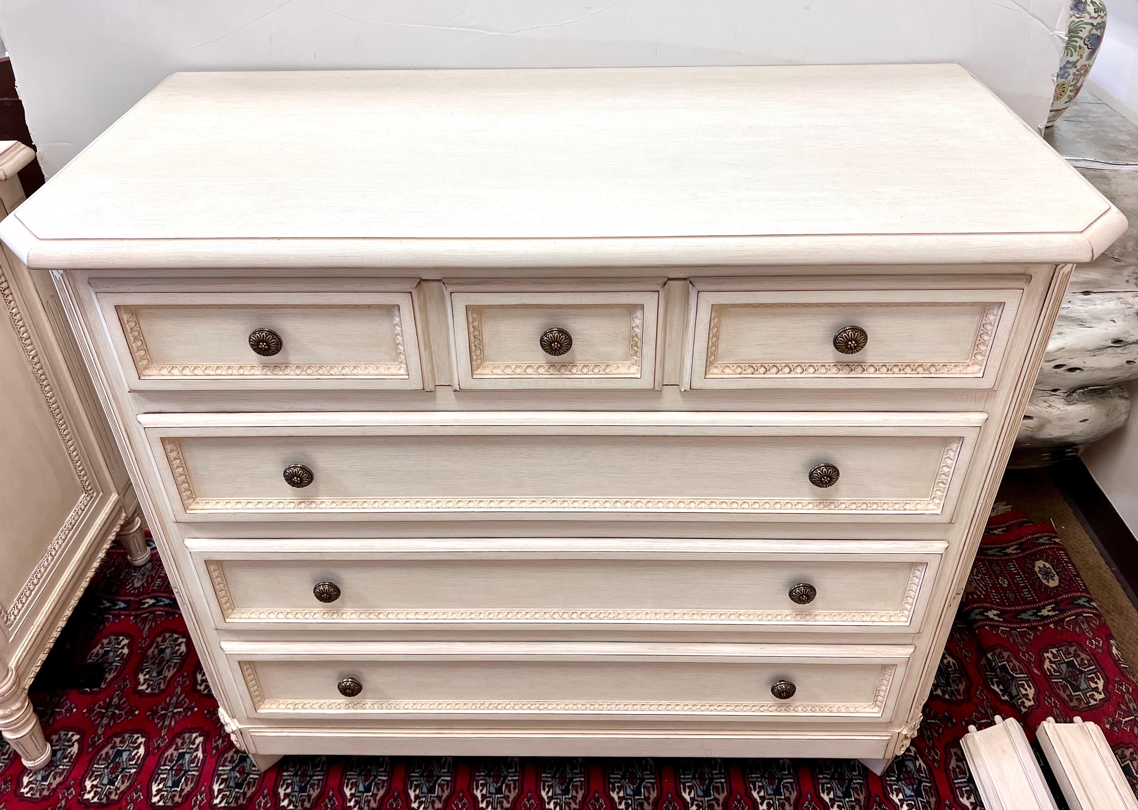 French style tall dresser by Louis J Solomon is meticulously crafted with intricate carved details and a beautiful distressed cream finish. Part of a larger set and note we are selling each piece individually. It offers functionality and
