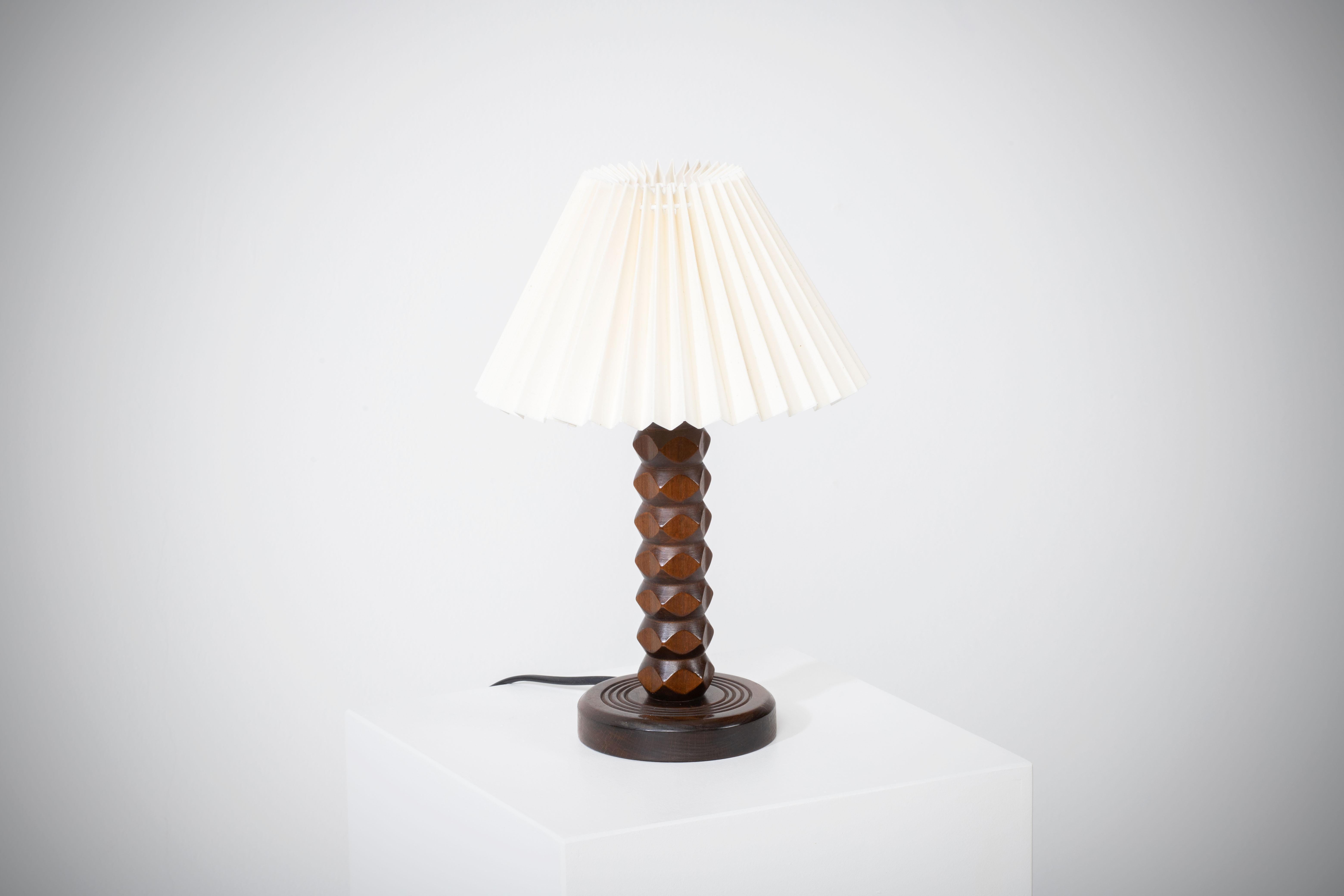 1950s hand carved oak table lamp in style of Charles Dudouyt.

Sold without lampshade.
 