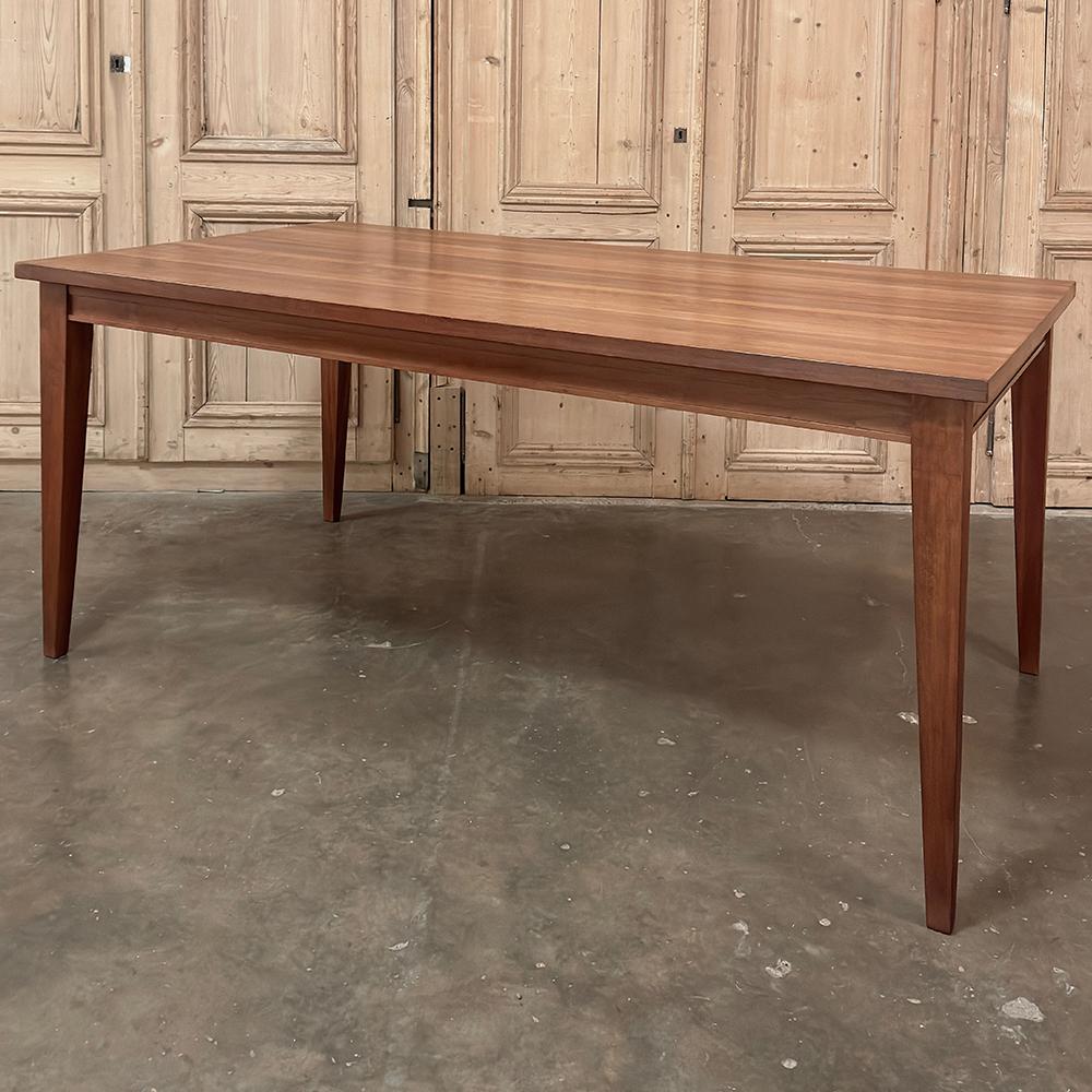 Mid-Century French Walnut Arts & Crafts Style Dining Table reflects the tailored architecture of the movement, with a straightforward approach to design that results in a simplistic beauty all its own!  The rich grain and natural coloration of the