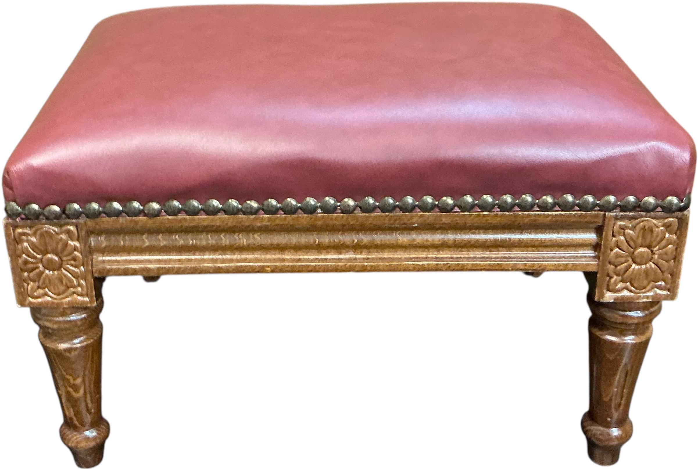 Mid-Century French Walnut & Leather Petite Ottoman / Stool / Bench This is a charming petite Louis XV style carved walnut stool with red leather upholstery. It is Italian and is marked on the underside. It is a mid-century piece and is in very good