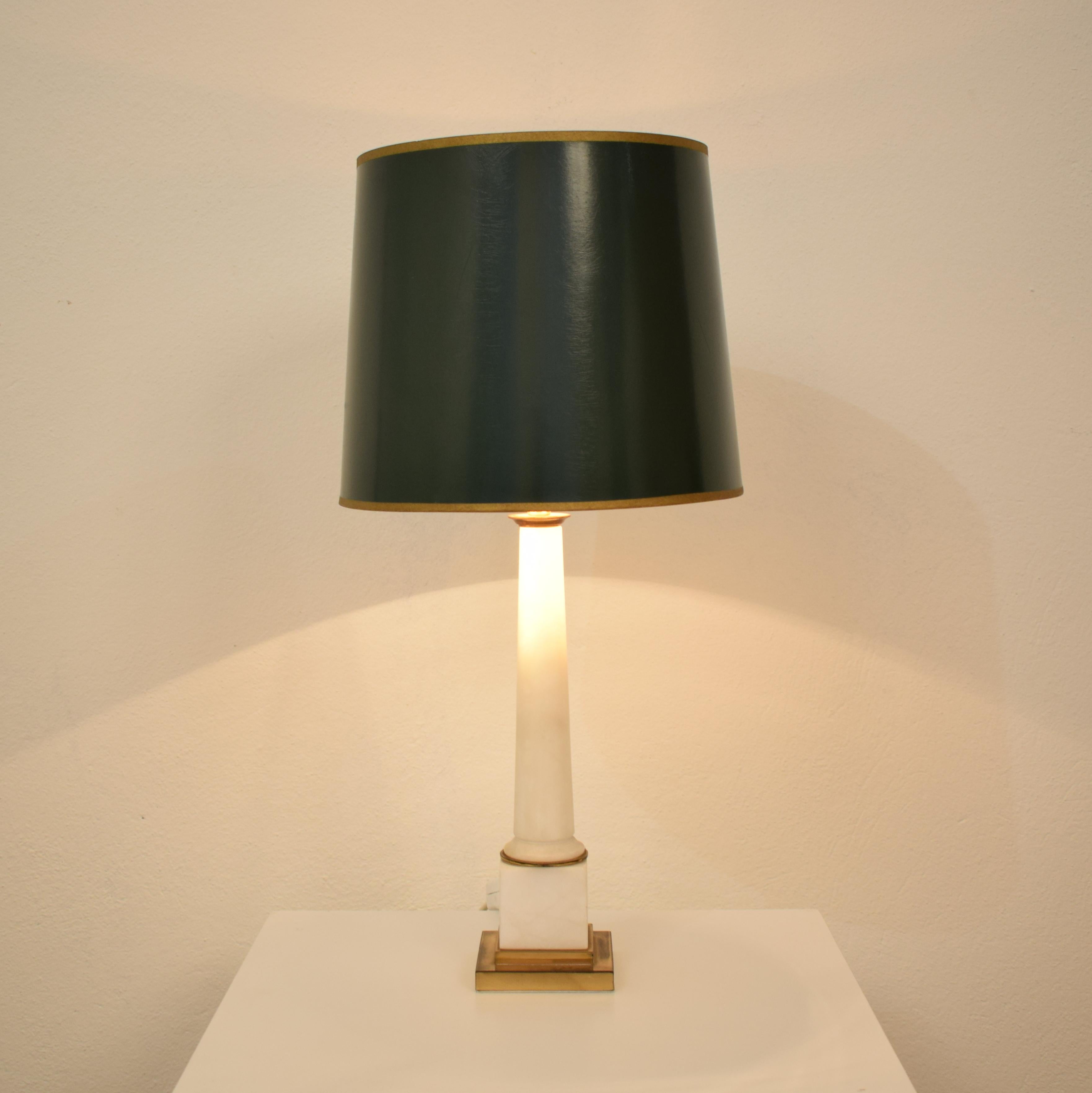 This beautiful table lamp was produced in the 1970s in France. It is made out of white marble and brass
The original lamp shade is dark green from the outside and gold from the inside.

The lamp without shade is 10cm x 10cm and the height is: