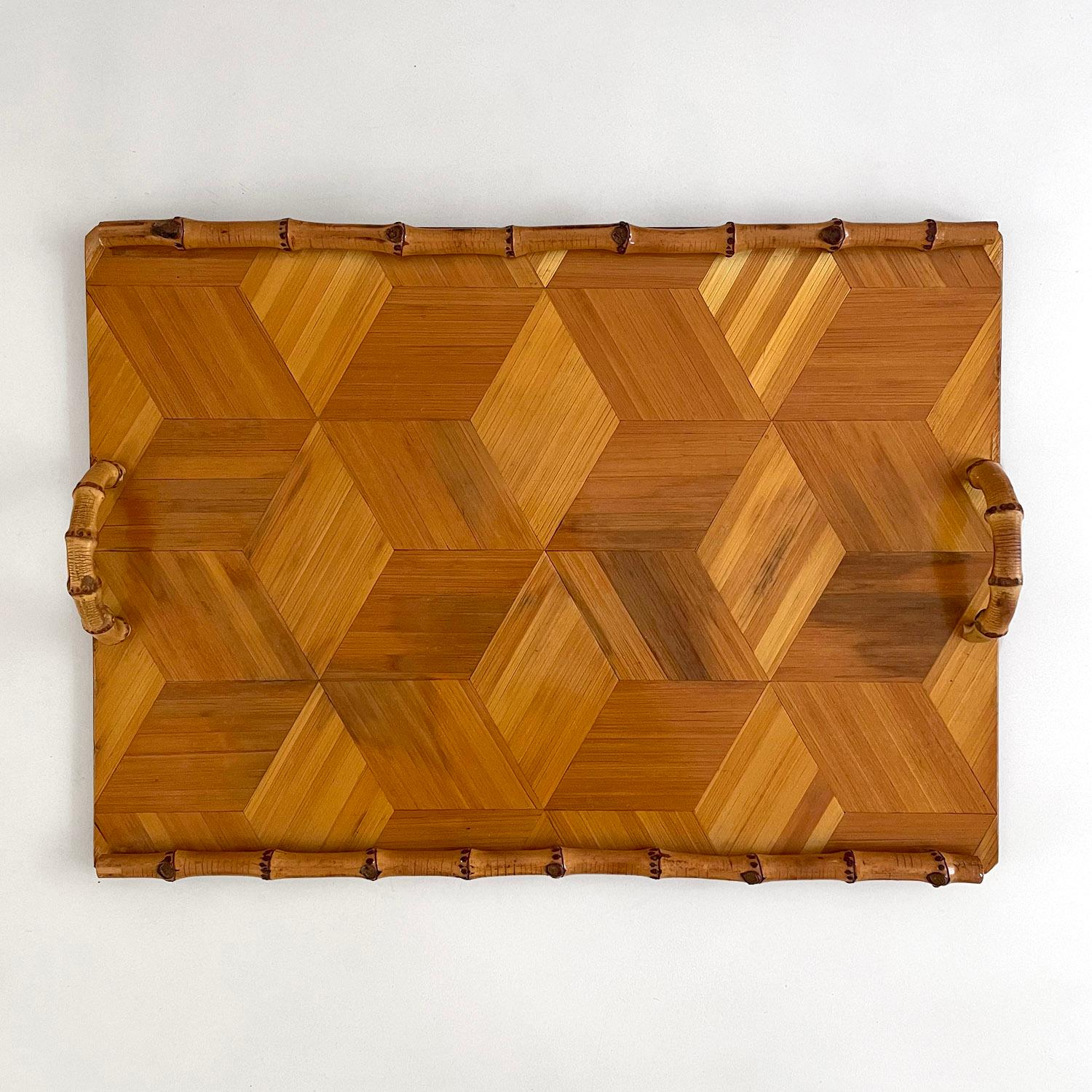French wood marquetry tray with bamboo handles makes for the perfect service item or wonderful addition to any coffee table 
Natural color variations throughout 
Rounded bamboo trim and curved half moon handles
Patina from age and use
Timeless