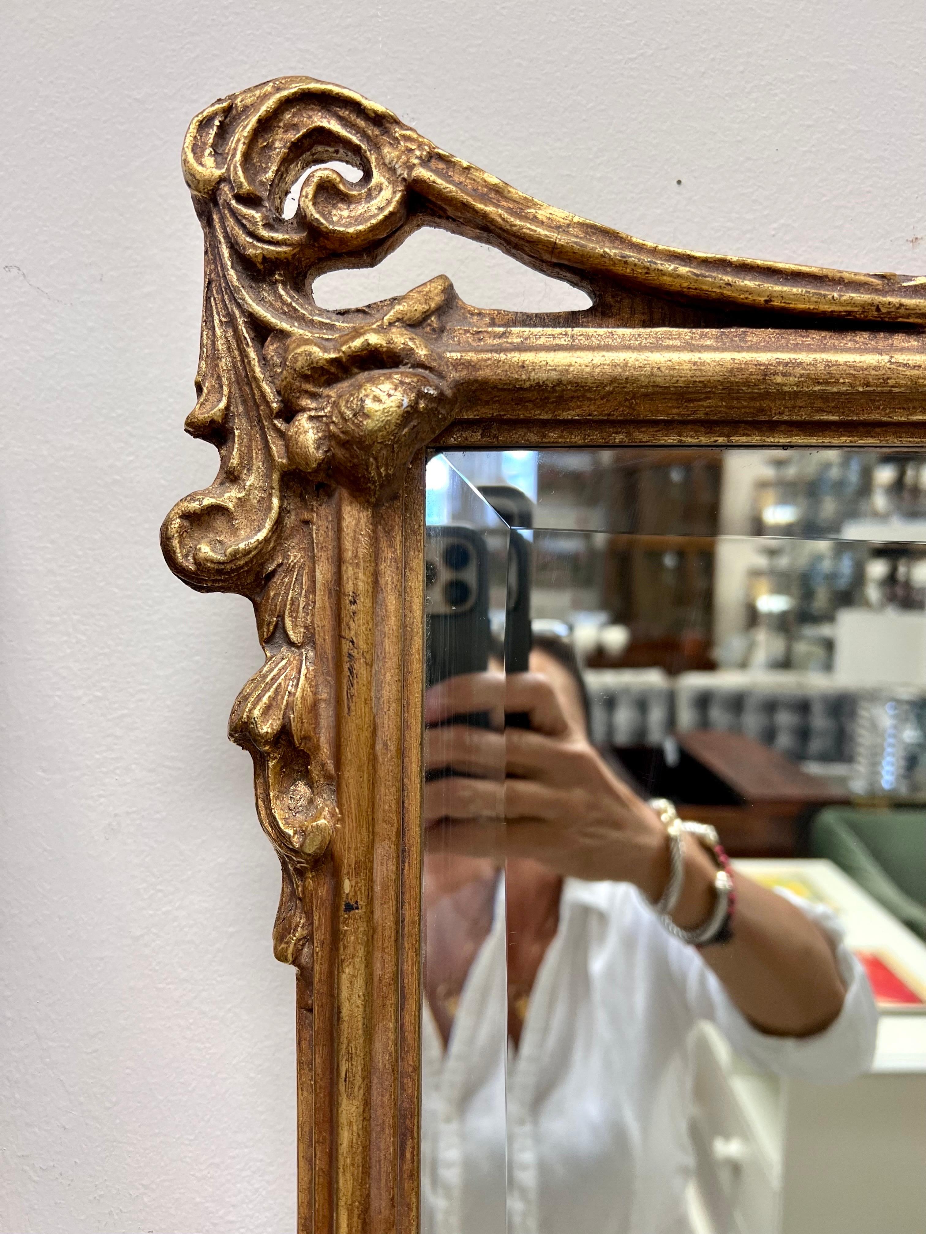 Signed Friedman Brothers for Decorative Arts, Inc. giltwood wall mirror that is ready to hang.  What makes the FB mirrors so sought after is the intricate carvings and exceptional craftsmanship.  Made in Italy.  Enjoy!  Why not own the best?