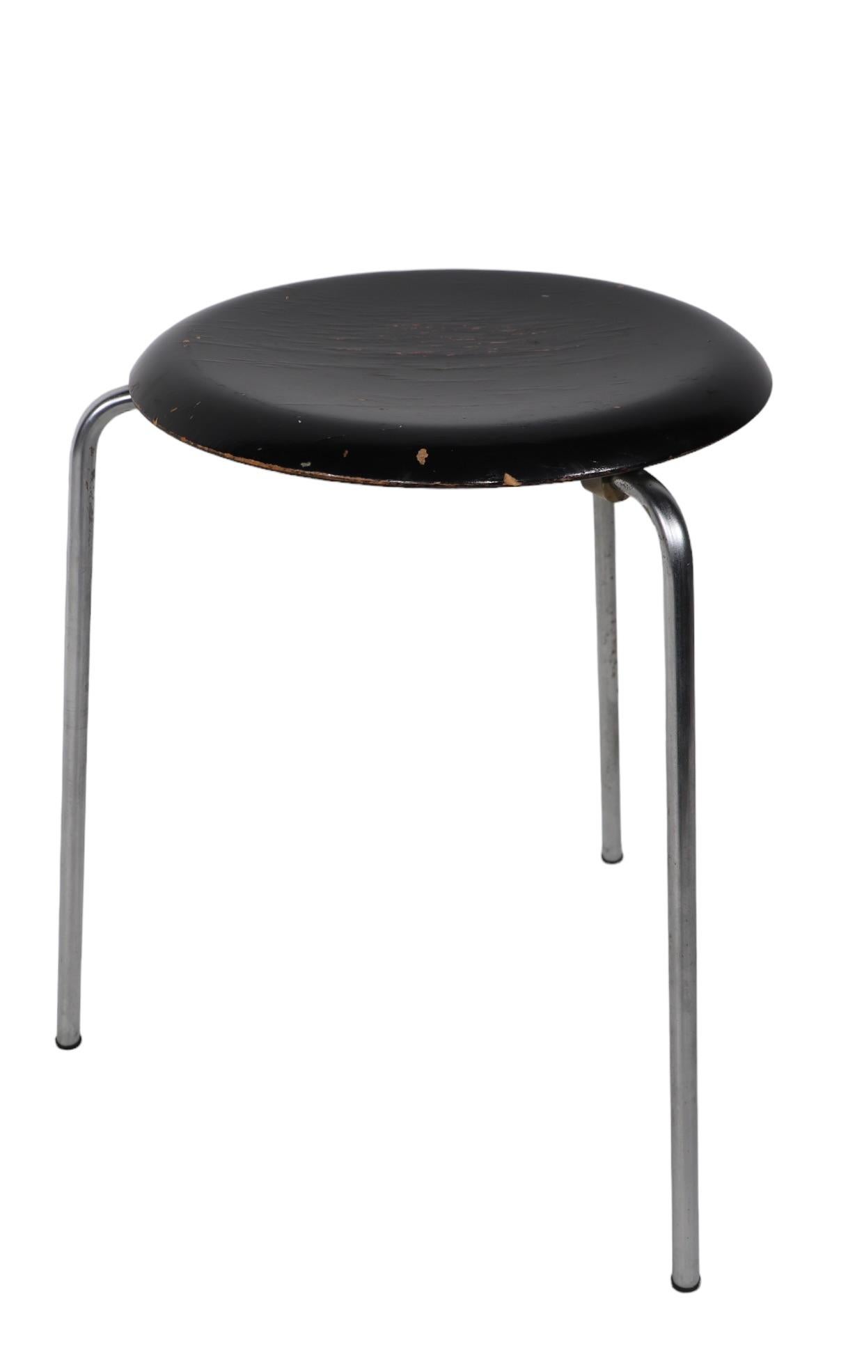 Classic Arne Jacobson Dot Stool, Made in Denmark by Fritz Hansen. This is a vintage three leg example, prior to the revised four leg version  released in  the  1970's. This example is structurally sound and sturdy, the chrome is bright and clean,