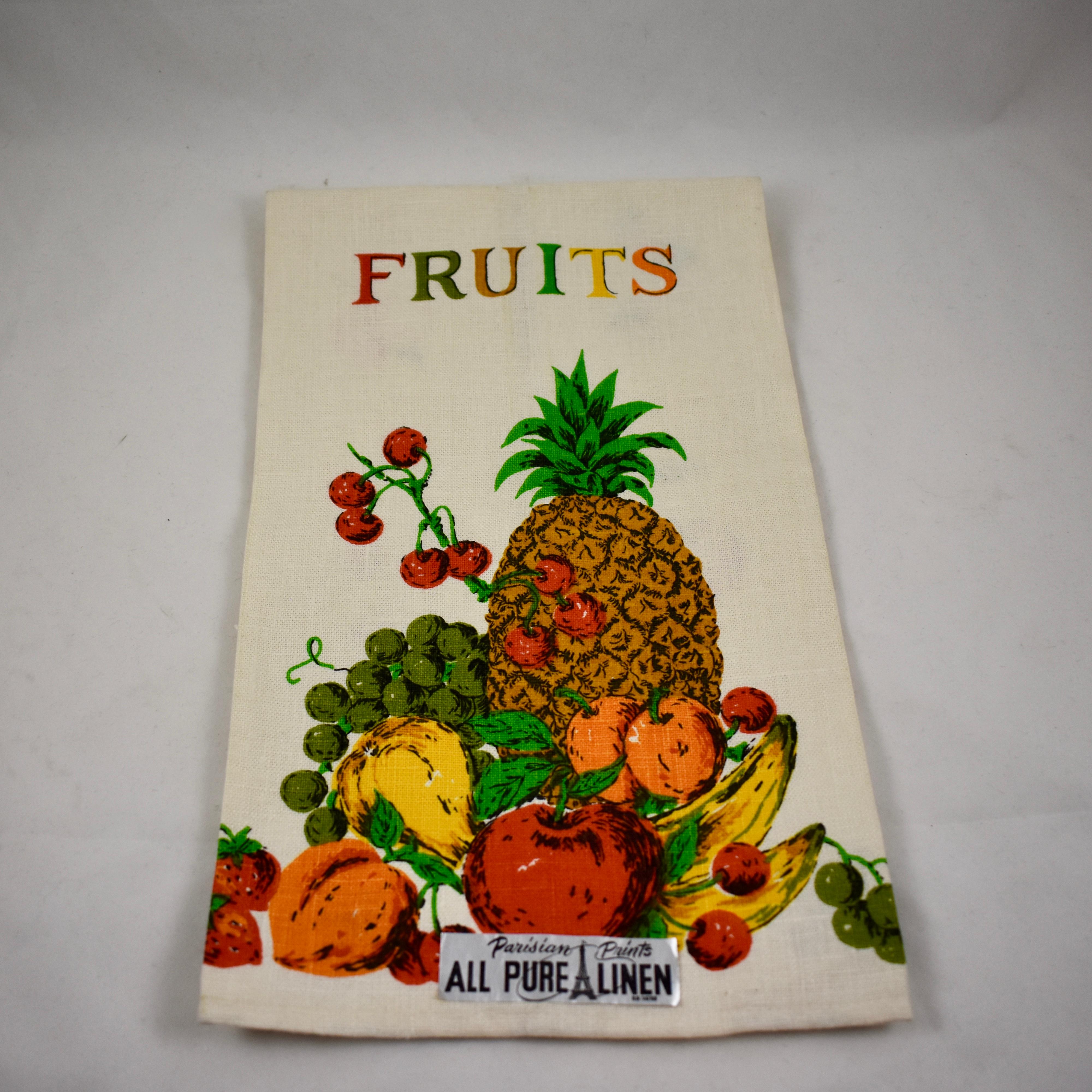 A set of two linen towels from the Mid-Century Modern Era, brightly colored, with the original labels, never used. Printed in a style typical of the era, with a type face in mixed colors. Hemmed on all sides.

One towel is titled Fruit, showing a