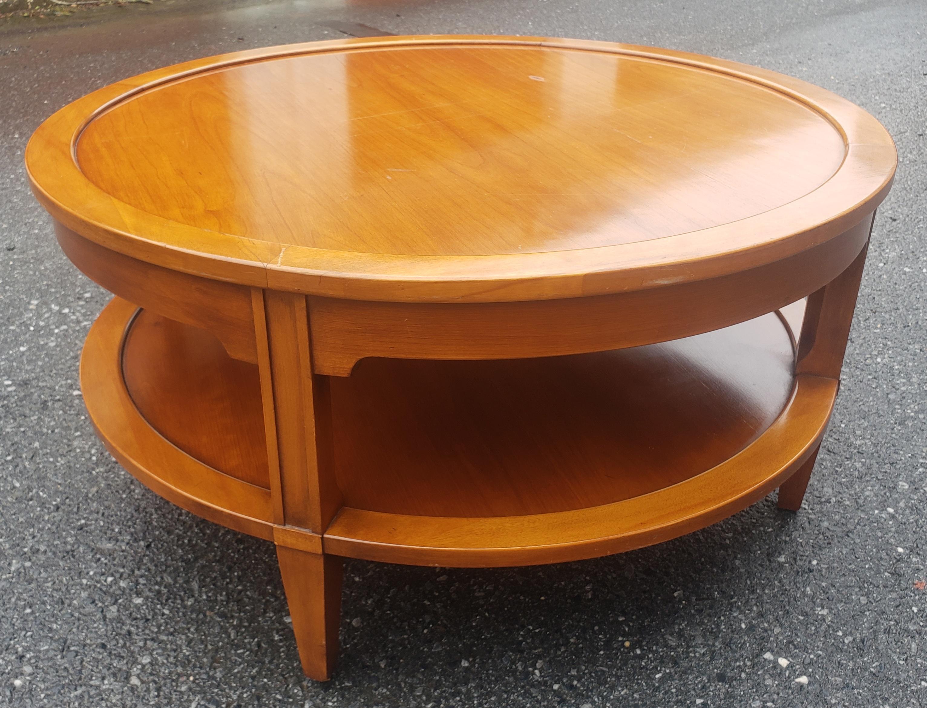 A MId-Century Fruitwood Two-Tier Coffee Table or Cocktail Table in good vintage condition. Measures 34.5