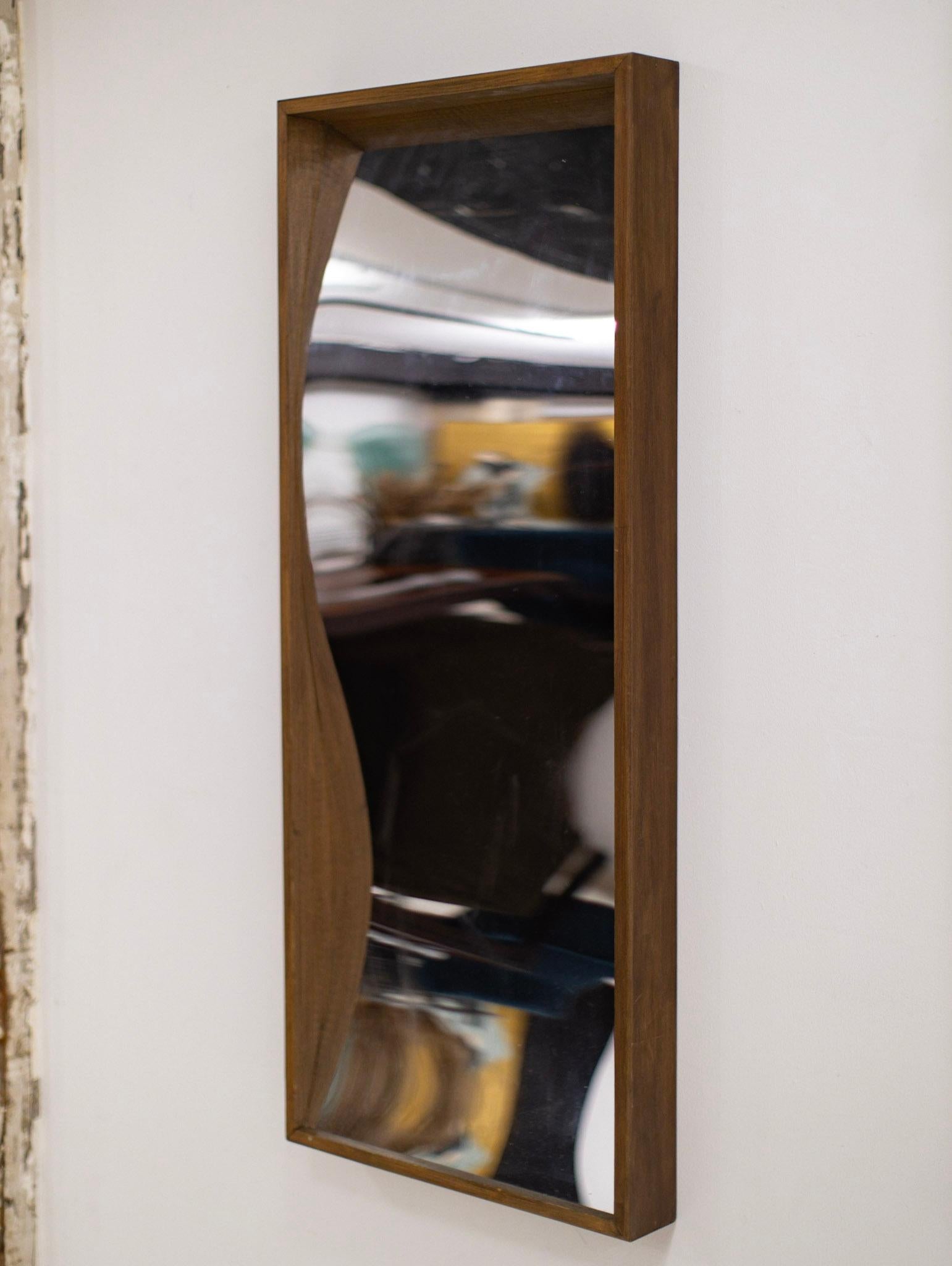 Mid century distortion mirror. Wood frame. Plastic mirror warps to create a distorted effect.