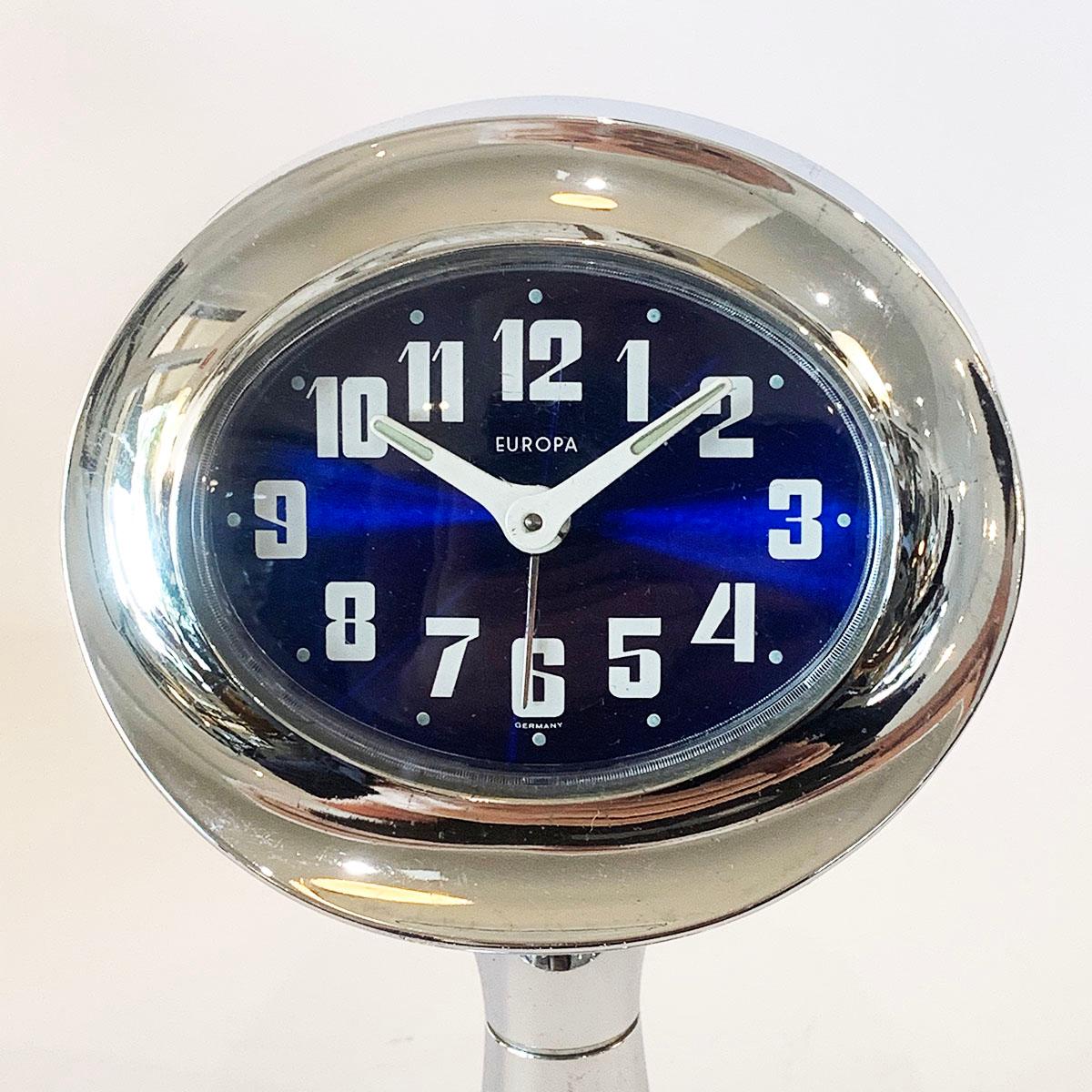 Midcentury futuristic clock by Europa the height of Design and so advanced, West Germany, circa 1950s. Chromed plastic and possibly solid blue Lucite body with extensive controls and Alarm to the rear. Face is perfect with illuminous dots every 5