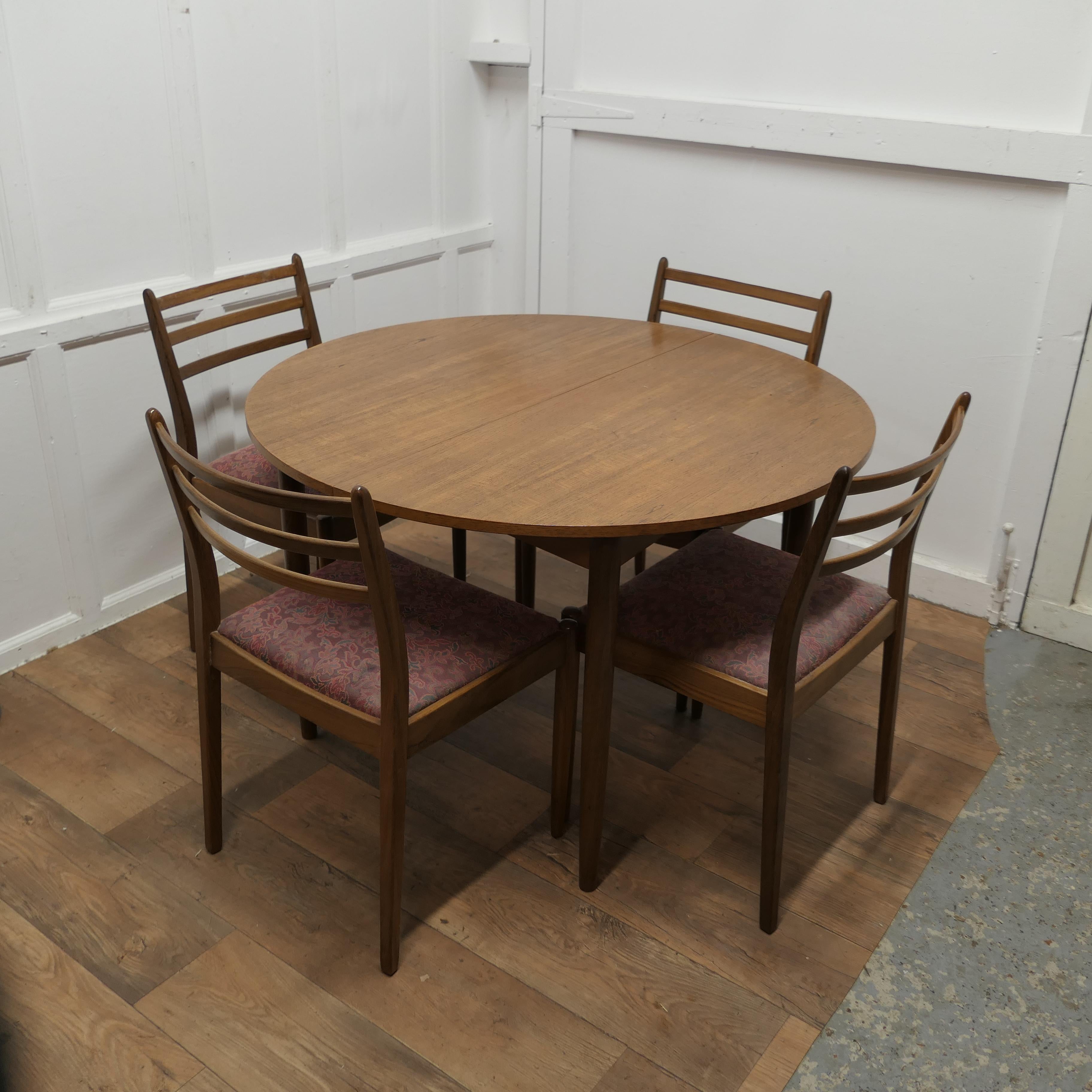 Mid-Century Modern Mid Century G Plan Circular Extending Dining Table and 4 Chairs    For Sale