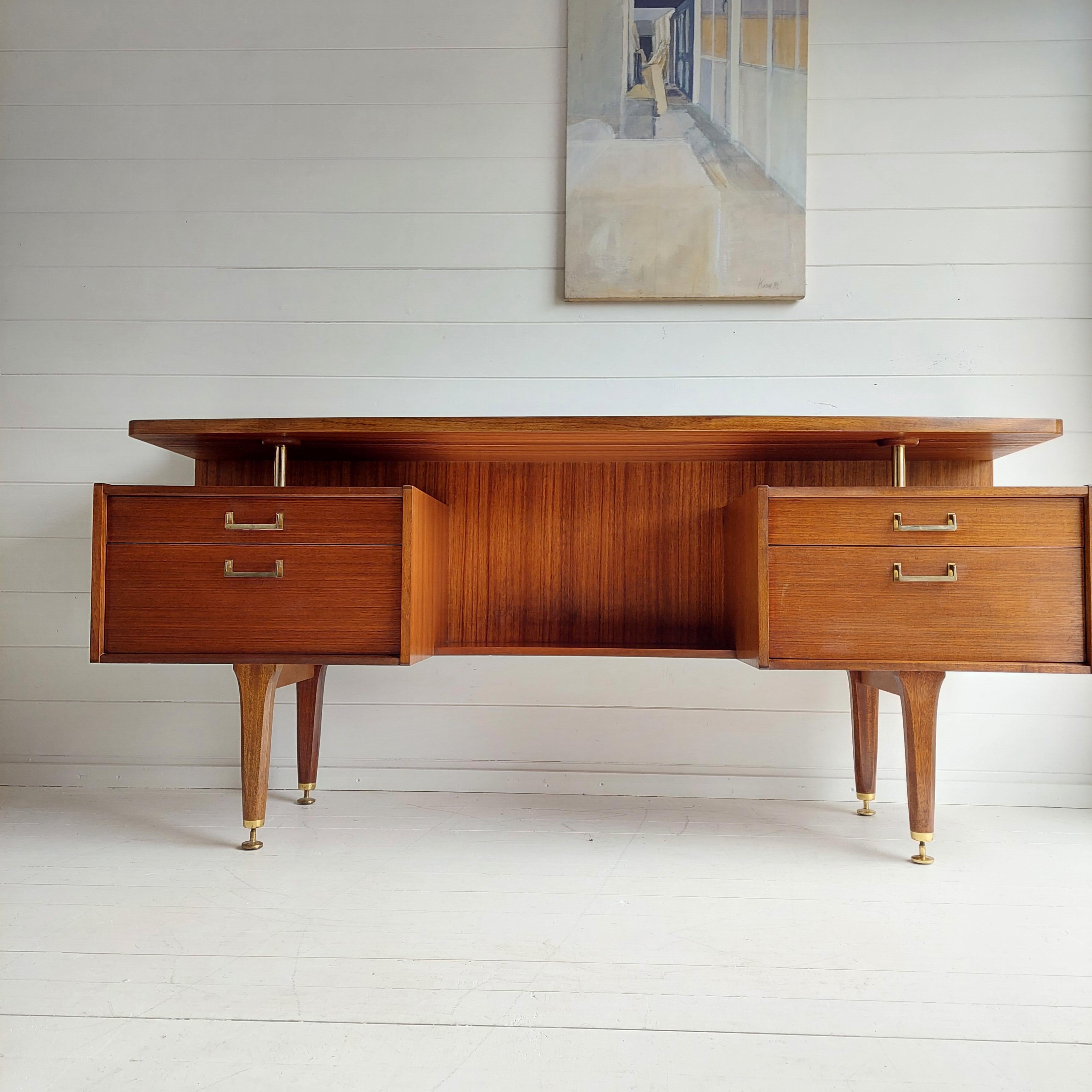 Fabulous vintage G plan E Gomme designed mid century 60s floating desk or dressing table.
Stamped G Plan. Designed by E Gomme for G-Plan
Made of Tola African Mahogany

Excellent build quality with no loose joints wobbles 
Freestanding unit with
