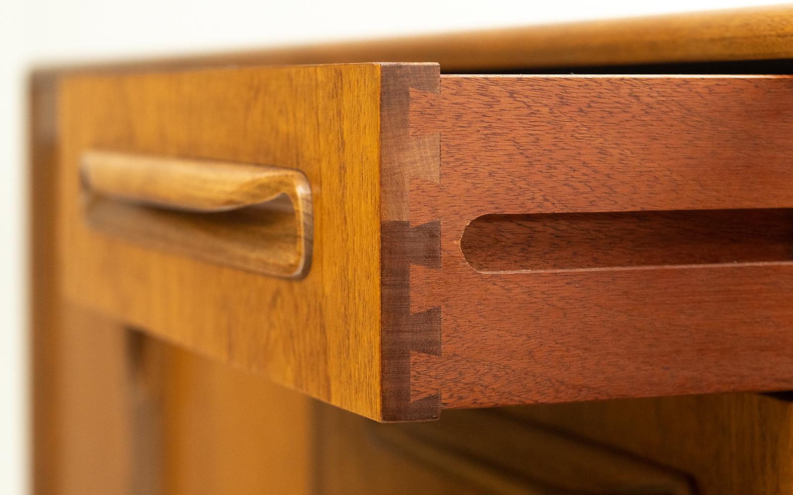 G Plan sideboard

A large mid century teak sideboard manufactured by G-Plan, designed as part of the famous 'Fresco' range.

Featuring contrasting solid teak door & drawer handles, four good sized drawers, two spacious cupboards with adjustable