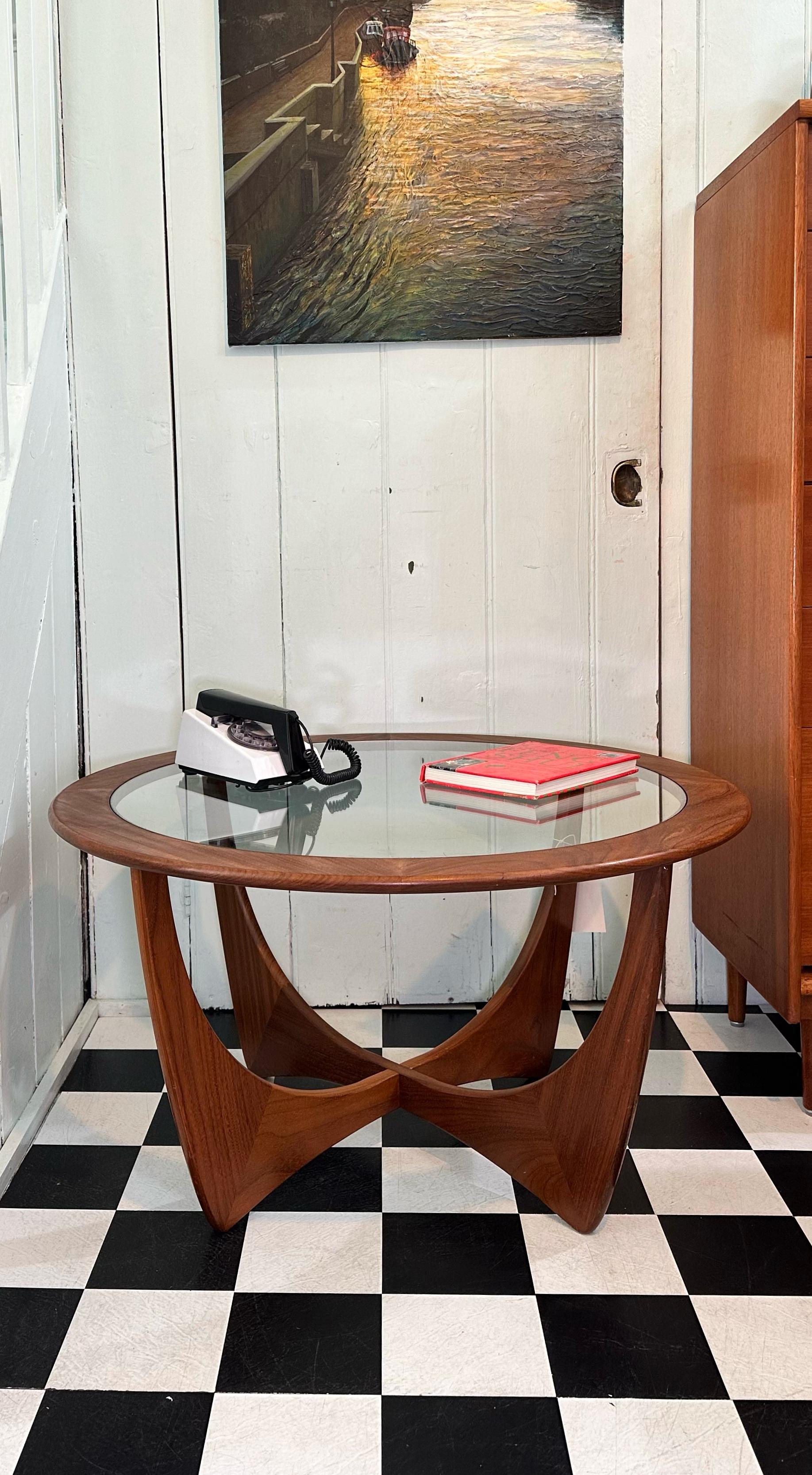 This iconic G Plan Astro table was designed by Victor Wilkins in the 1960s.

Made from solid teak with glass insert in the middle. This is a truly stunning piece with beautiful golden grain and sleek curved lines.

The table is in excellent vintage
