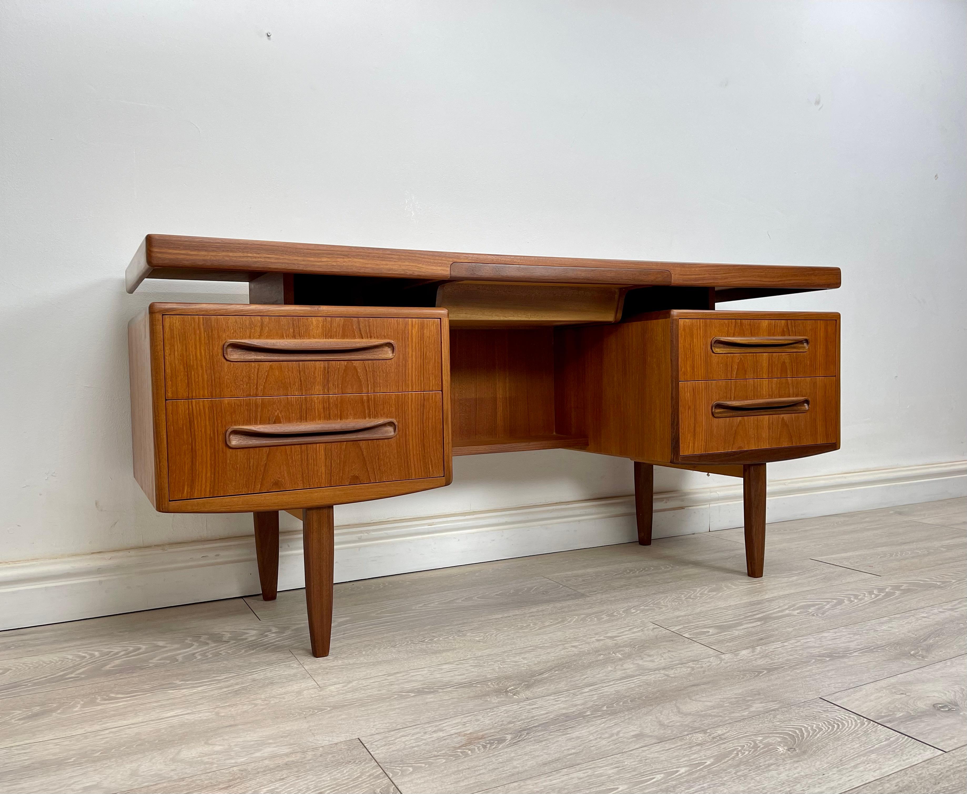 TEAK DESK 
Stunning midcentury Teak floating desk made by G Plan fresco range circa 1970 . 

The desk has stunning grain and golden patina throughout , there’s four drawers and a secret black felt lined top drawer all run smoothly . 
s run