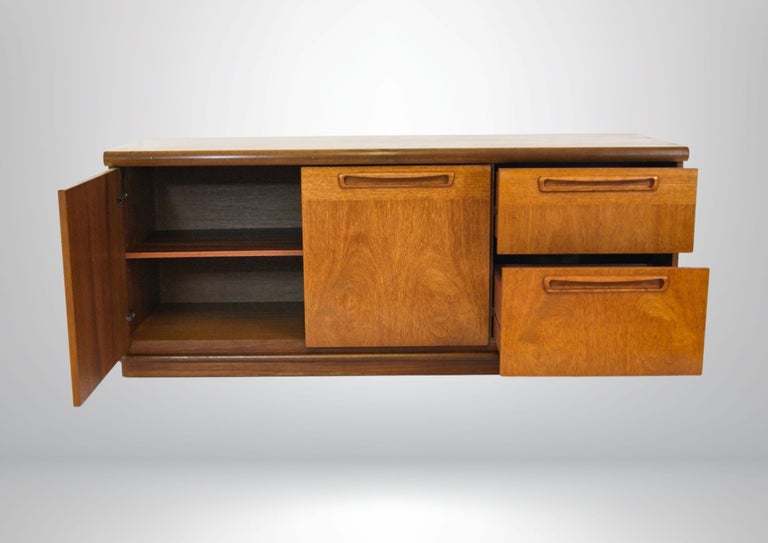 Mid-century G Plan teak sideboard.
Can be used as a floating cabinet with the option of securing it to a wall or freestanding on the floor. Wall cleats not included.
Features 2 doors with split level internal shelving sections and 2 drawers.
Clean