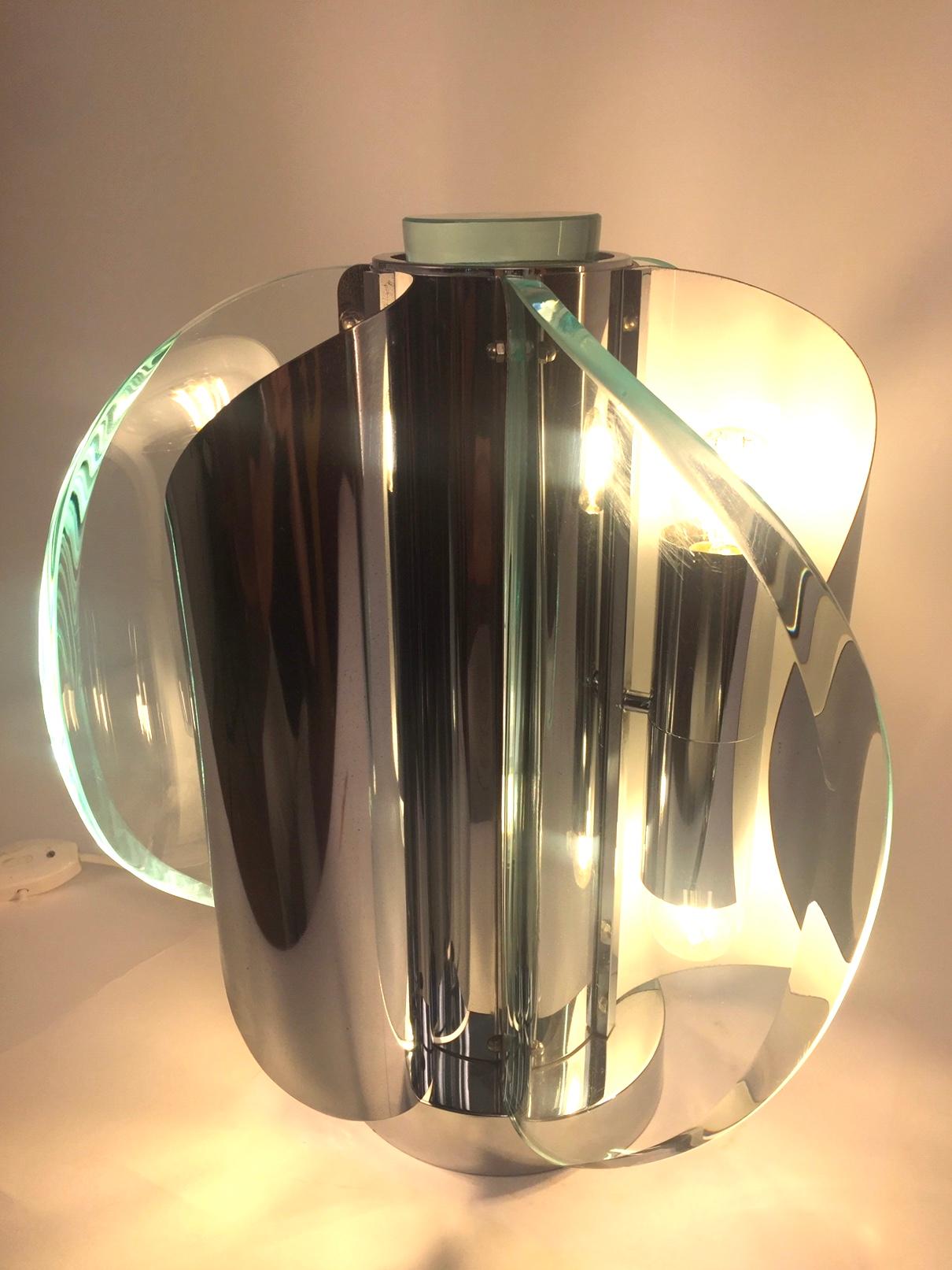 A extremely rare lamp designed by Gaetano Sciolari. Chromed steel and thick molded glass. Excellent vintage condition.Professional packing and shipping provided.