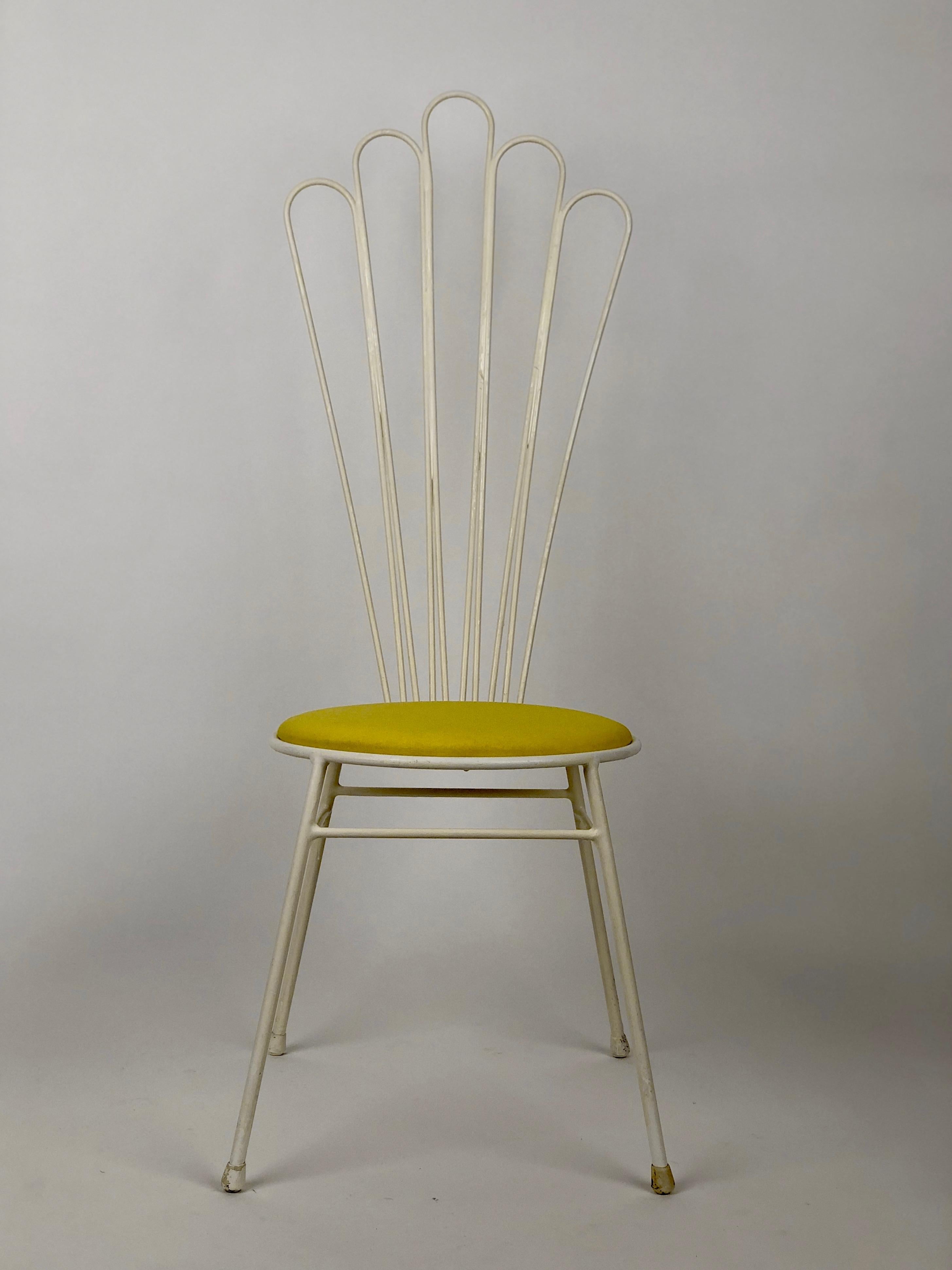 A lovely addition to your garden furniture, this chair comes from Austria. Welded steel rods have been bent to form a sea shell pattern. The seat has been refitted with new padding 
and recovered in a lemon yellow fabric.