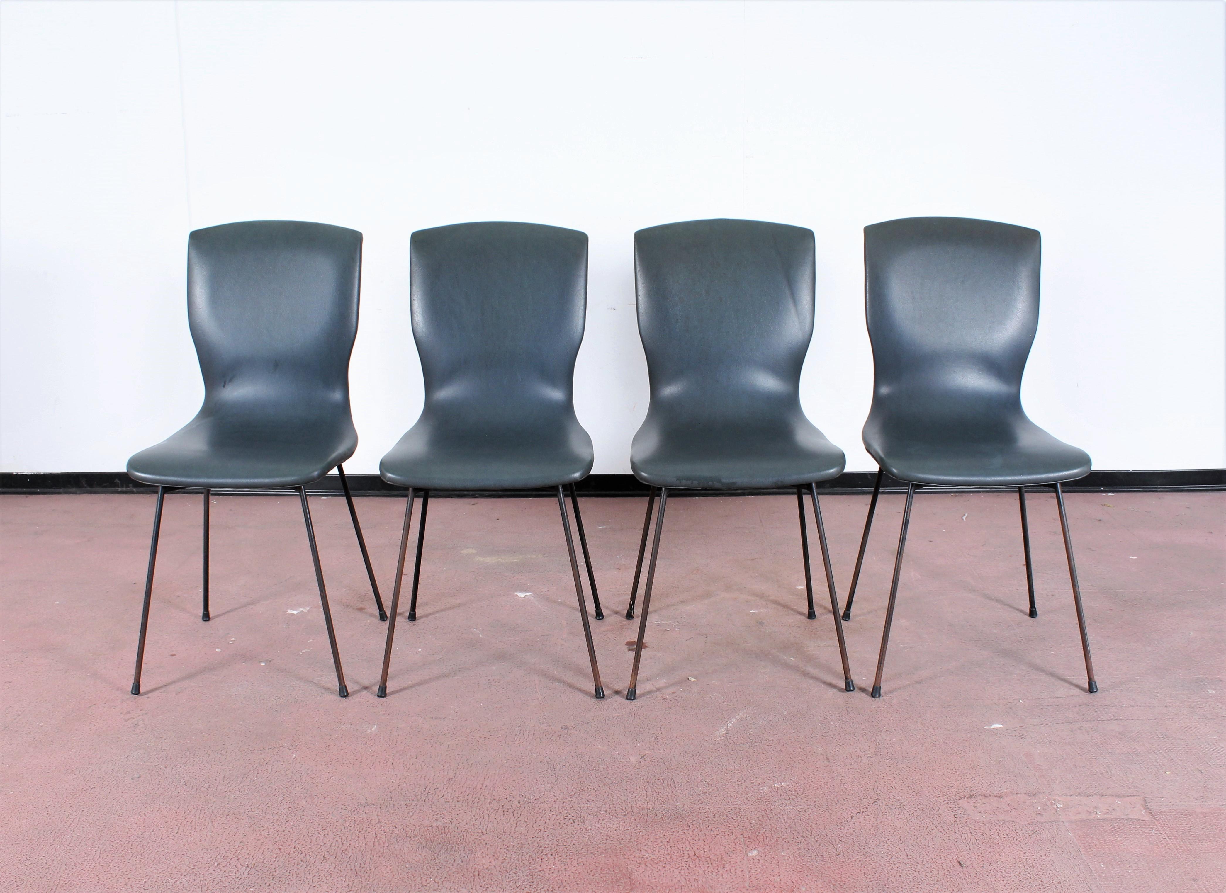 Set of four dining chairs made of metal structure, mid-blue faux leather covering. Modern Italian design attributed to Gastone Rinaldi in 1960s
Wear consistent with age and use.
 