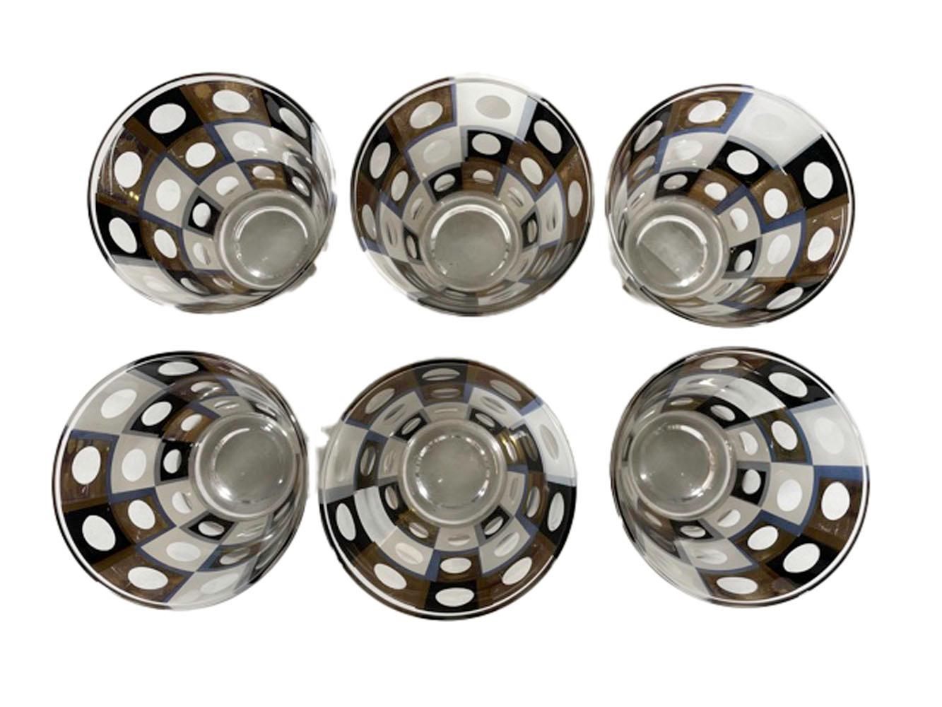 Thirteen piece geometric patterned barware set in a black and white enamel with 22k gold design of squares with clear circles in the center of each. The set is comprised of 6 highball and 6 old fashioned glasses with an ice bowl.