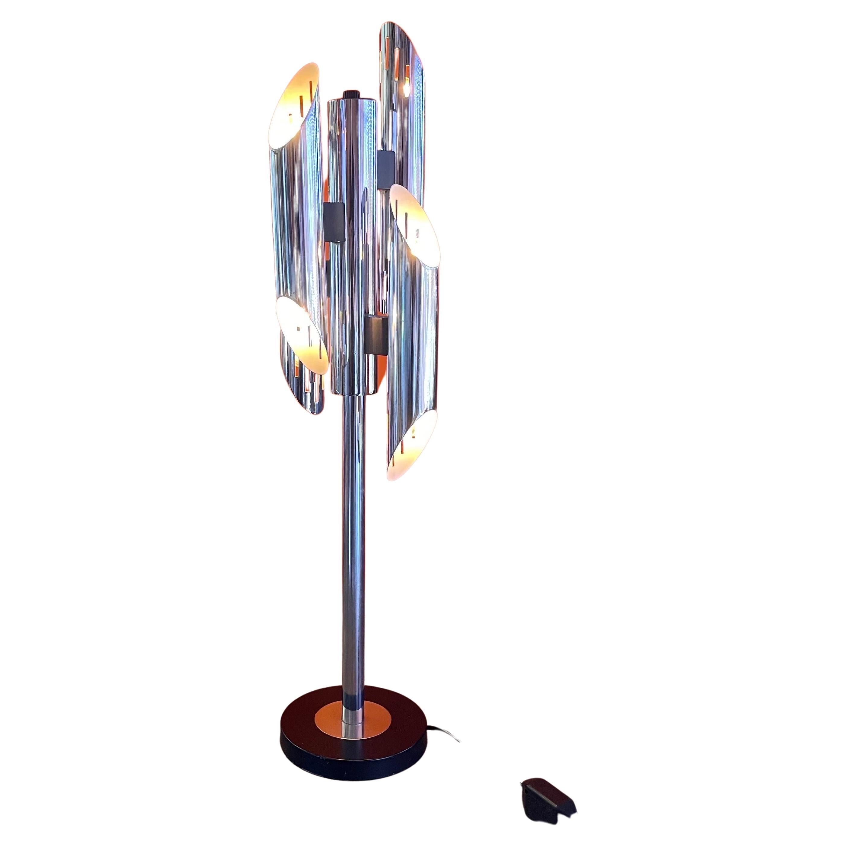 Mid-century geometric eight socket chrome table lamp by Gaetano Sciolari, circa 1970s.   A mid-century original both glamourous and sculptural!  Consisting of highly polished chrome with black painted metal, the lamp has eight lighted sockets and a