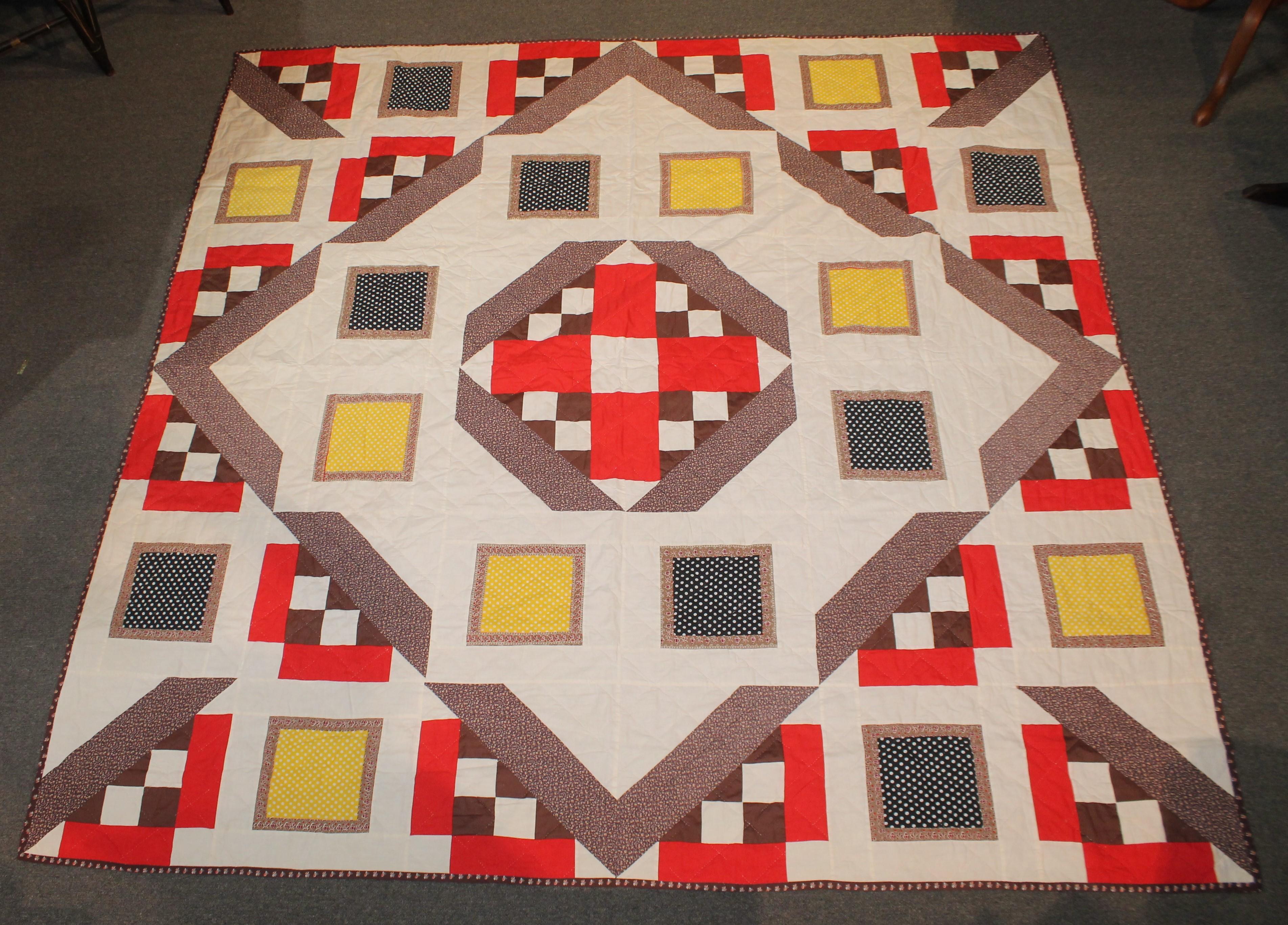 This modern stylistic geometric block pattern is from the 1960s and has a great unusual block pattern. The backing is in a brown calico fabric.