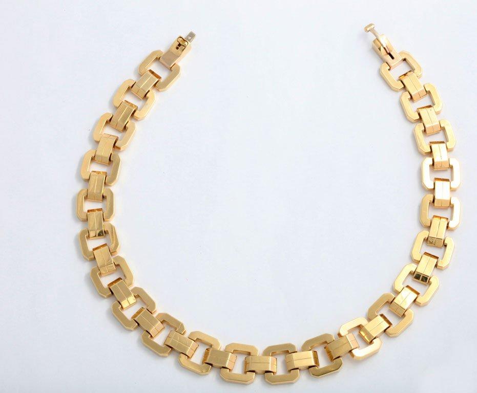 Beautifully made 18k yellow gold elegant necklace by Italian jeweler Oreficeria Biffi Danilo (Circa 1964-1971 in Vicenza).  The geometric design features square links connected by double bridge links.  To open the clasp you pull up the tab and then