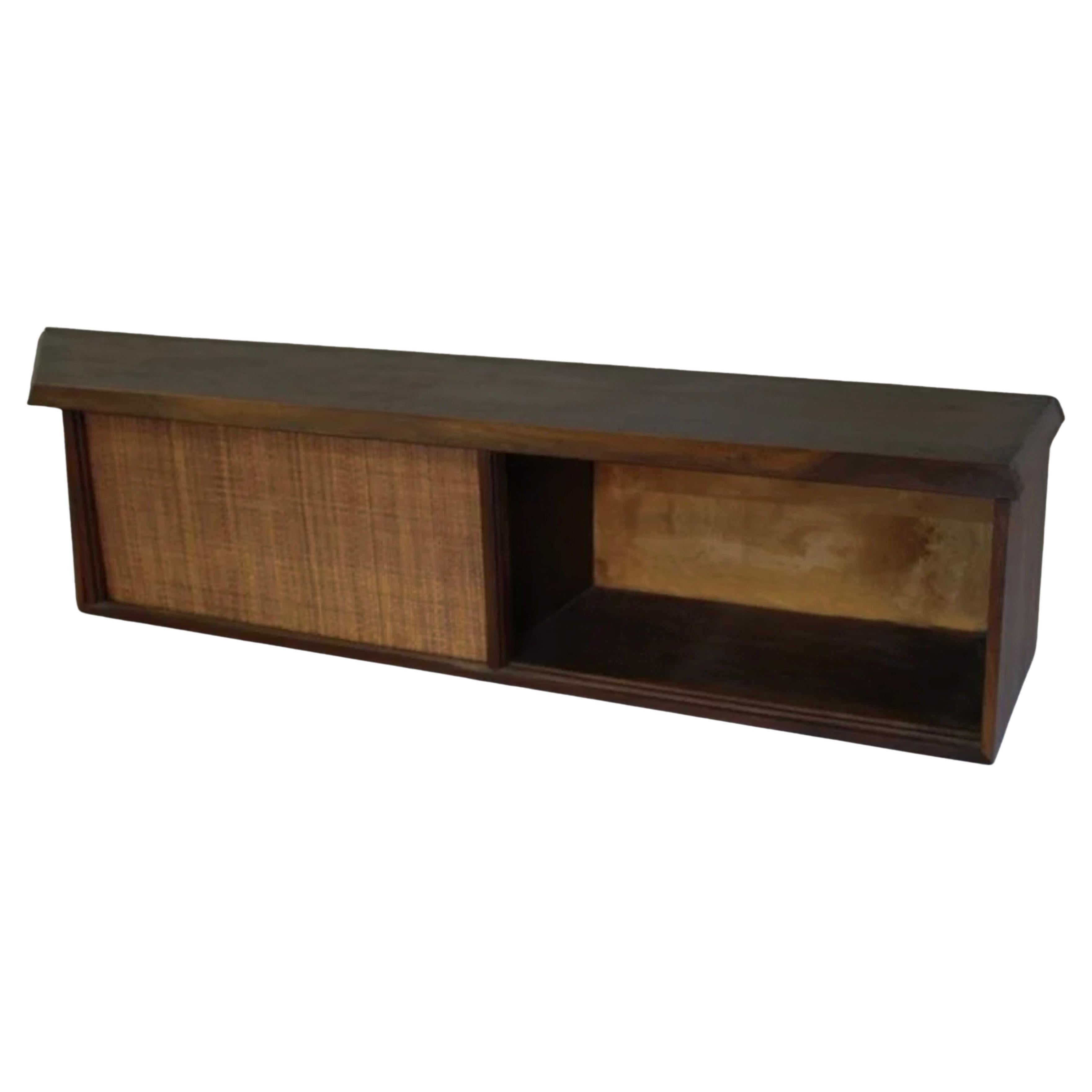 Mid Century George Nakashima Style Wall Mounted floating credenza or shelf with 2 grass cloth front sliding doors. Beautiful black walnut wood with 2 interior sections. Great edition to any modern designed organic home interior. Made in USA. Located