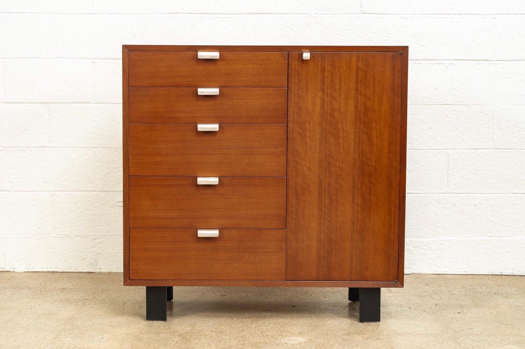 This Mid-Century Modern cabinet was designed by George Nelson for Herman Miller in 1946 for his “Basic Series” of modular furniture that coordinate in size, shape, and design and includes the now iconic Nelson platform bench. With clean, rectilinear