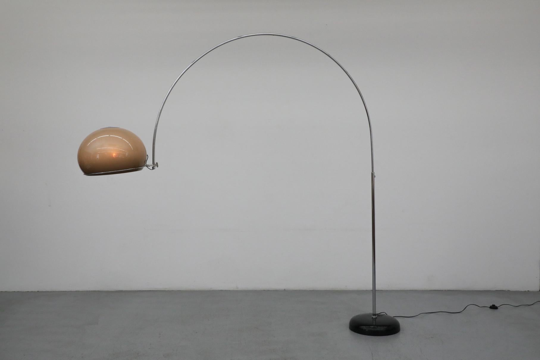 Mid-Century Gepo chrome lamp with beige plexiglass domed shade that sits in a thin arced chrome stem. The shade can sit upwards or shine downward in the chrome ring. A knob loosens to alllow the ring to reposition. In original condition with visible