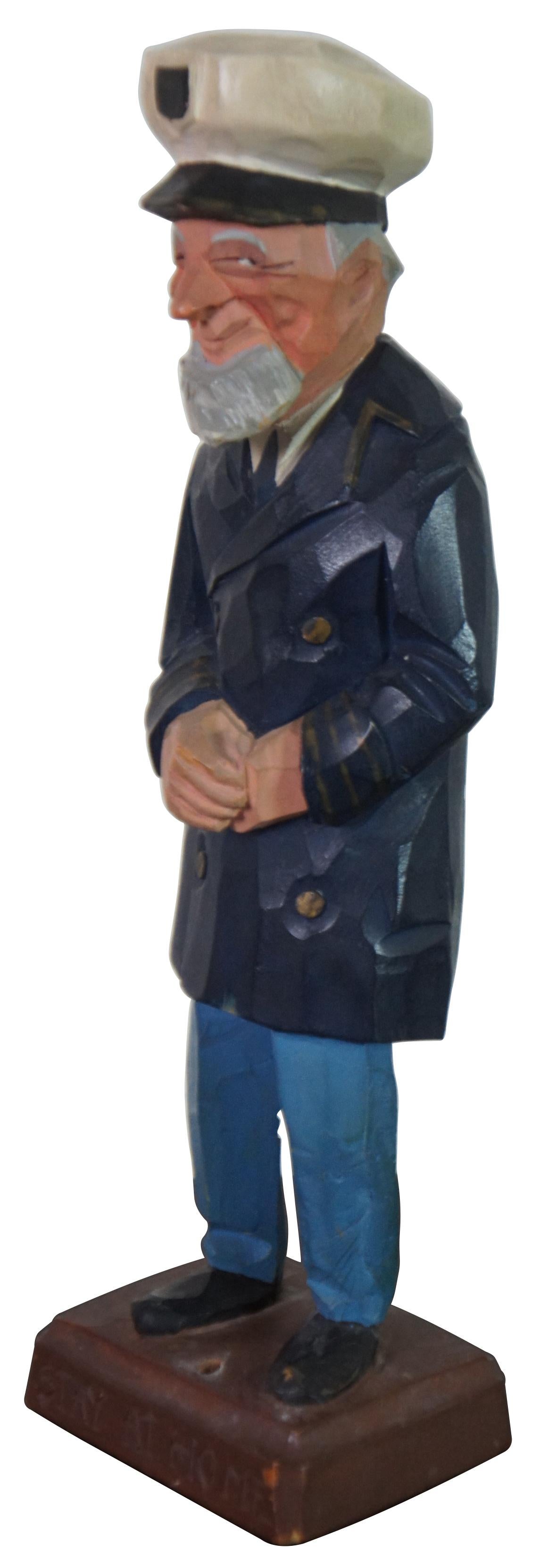 Mid Century carved wood folk art figure by Gerald Pat Hannah titled “Stay at Home,” featuring an old man dressed as a sea captain, once leaning on a walking stick. “One of the original three Hannah brothers (Charles, Pat and Tom) who became wood