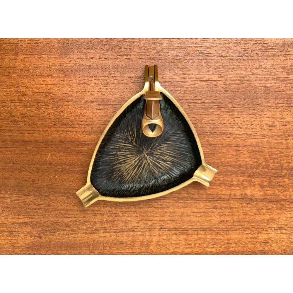 Mid-Century German Brass Ashtray with Cigar Cutter, 1950s, in Very Good conditions. Designed 1950 to 1959.

Additional information:
Materials: Brass
Color: Black
Styles: Mid-Century Modern
Country of Origin: Germany
Item Type: Vintage, Antique or