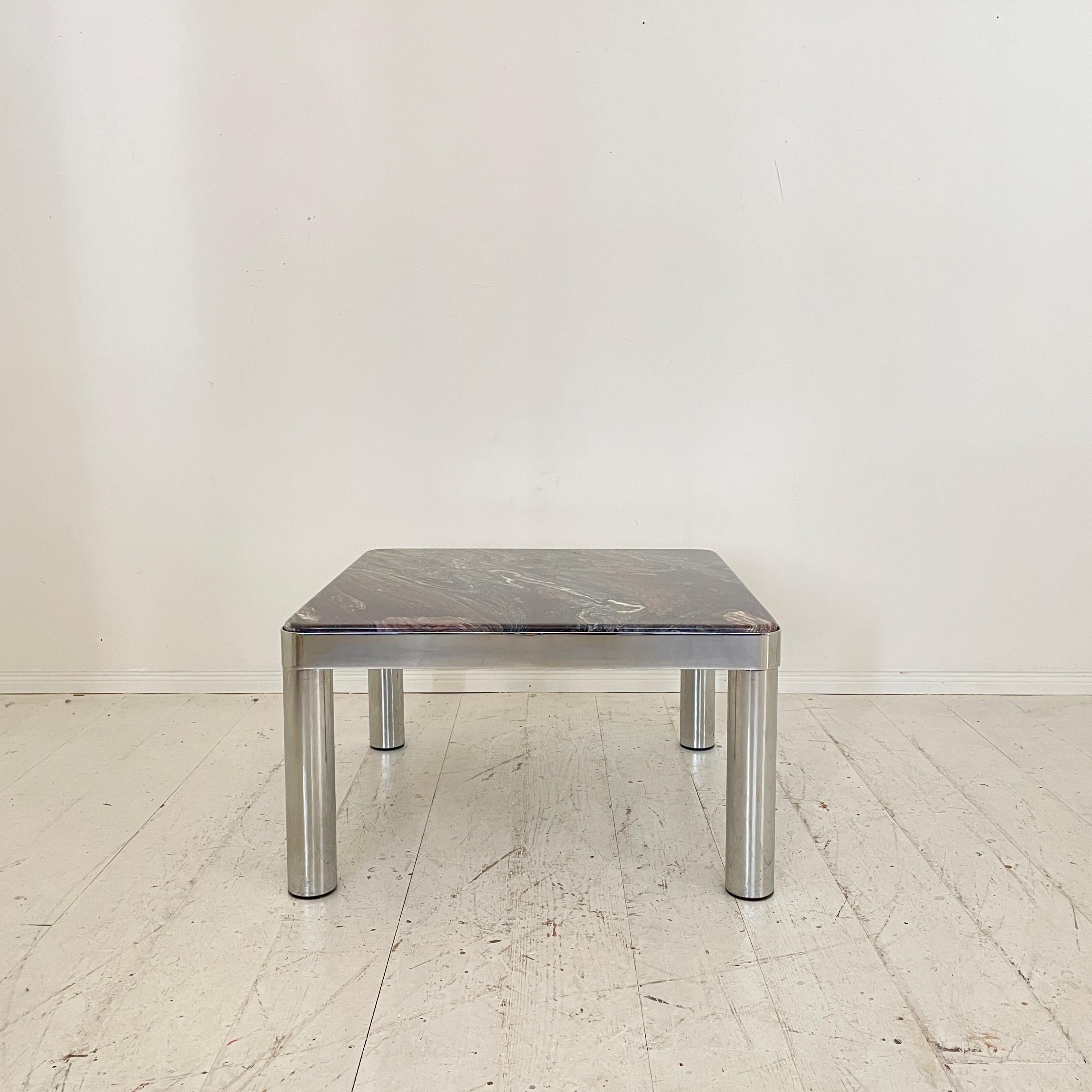 This unique Mid-Century German Coffee Table was made 1971. The table is made out of chromed Metal and Marble.
The table is ion perfect vintage condition.
A unique piece which is a great eye-catcher for your antique, modern, space age or mid-century