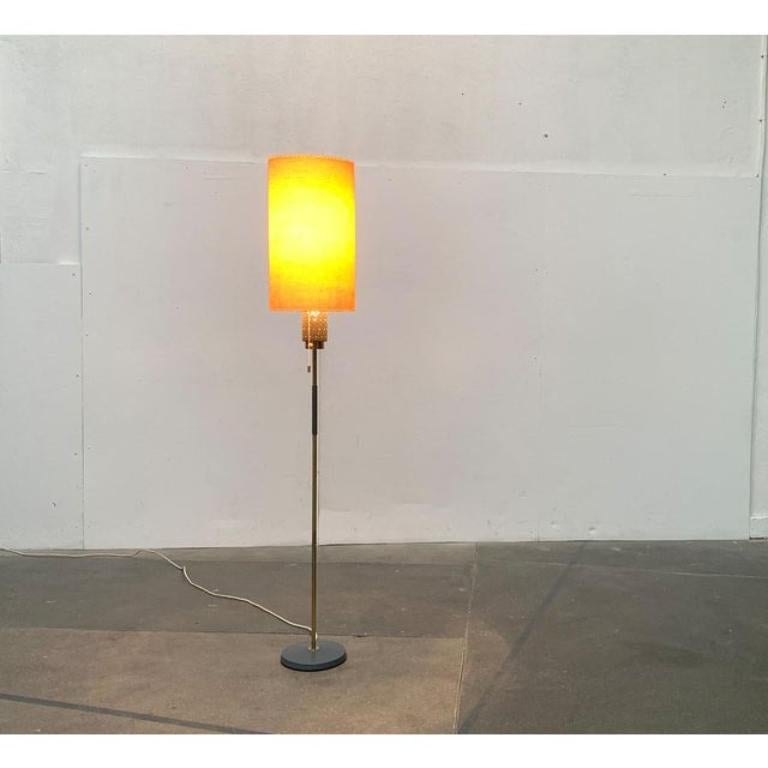 Very rare mid century standing lamp with striking hole details from hillebrand after a design by ernest igl from the 1960s.

A draft that convinces with its high-quality workmanship and the elaborate details. The characteristic coloring in brass and