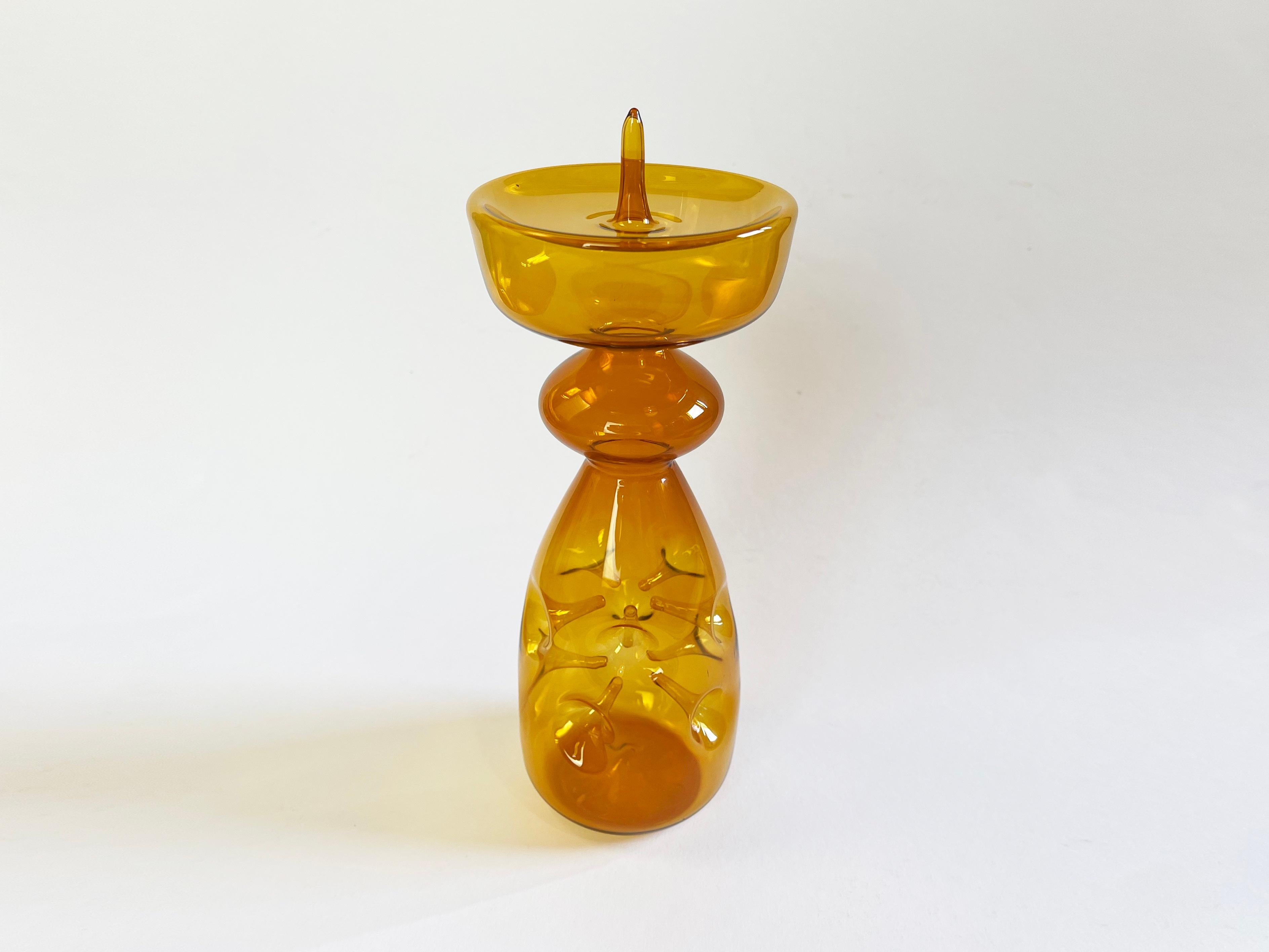 Absolutely fantastic candlestick by Albin Schaedel, GDR, Lauscha - the war left its mark: in the ''Series'' ''Grenades'', Albin 
Schaedel has produced different works of art: here is this fabulous candlestick made of amber-colored, delicate glass,
