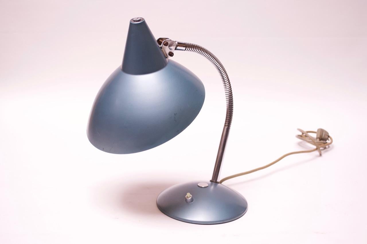 1950s Helo Leuchten table lamp in original metallic blue lacquered metal and chrome. Fully adjustable shade and gooseneck stem. Light wear consistent with age / use (few scratches and spots to shade and base / general minor wear). Overall, nice,