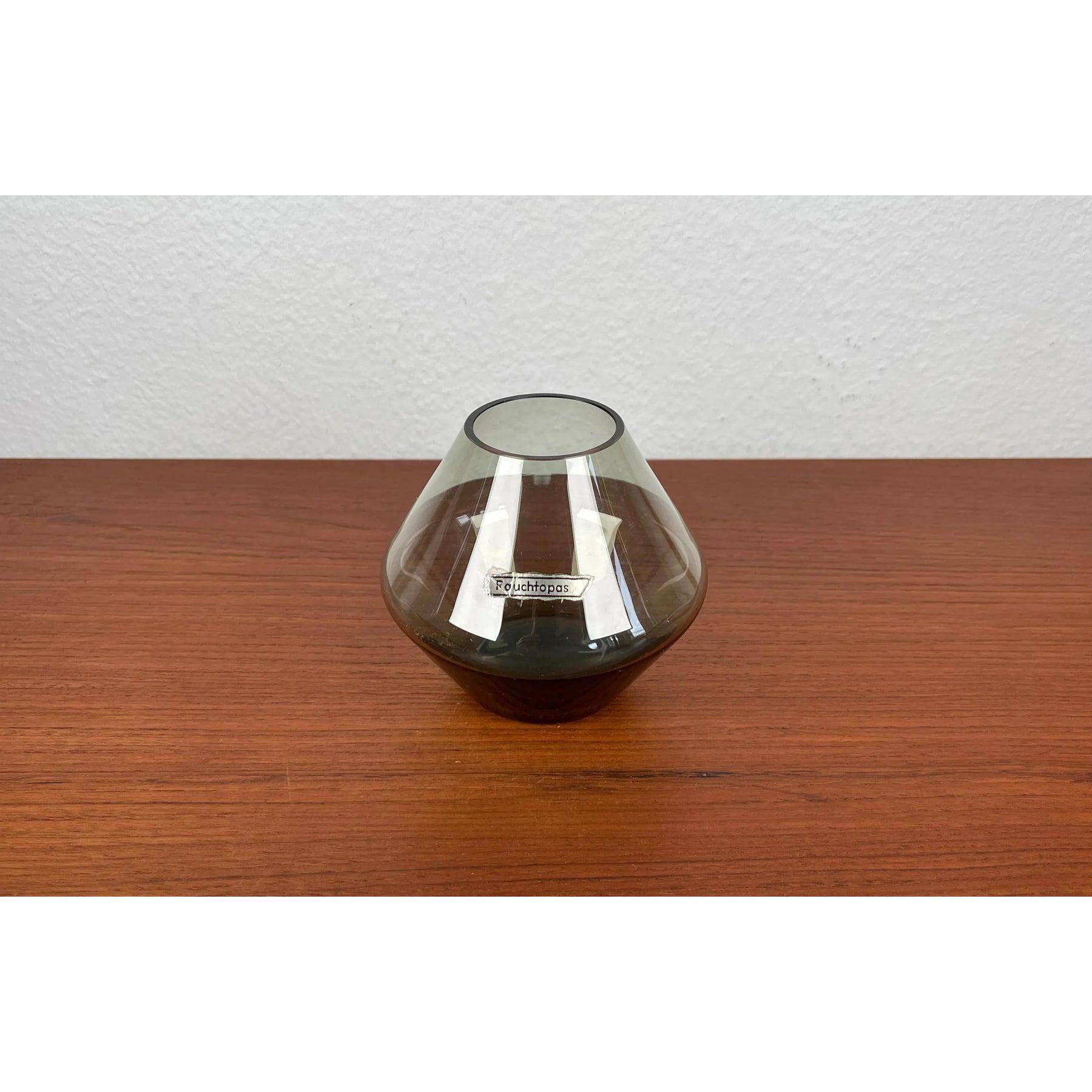 Mid-Century German Minimalist Glass Vase Rauchtopas, 1960s, in Very Good conditions. Designed 1960 to 1969.

Additional information:
Materials: Glass
Color: Grey
Styles: Mid-Century Modern, Minimalist
Country of Origin: Germany
Item Type: Vintage,