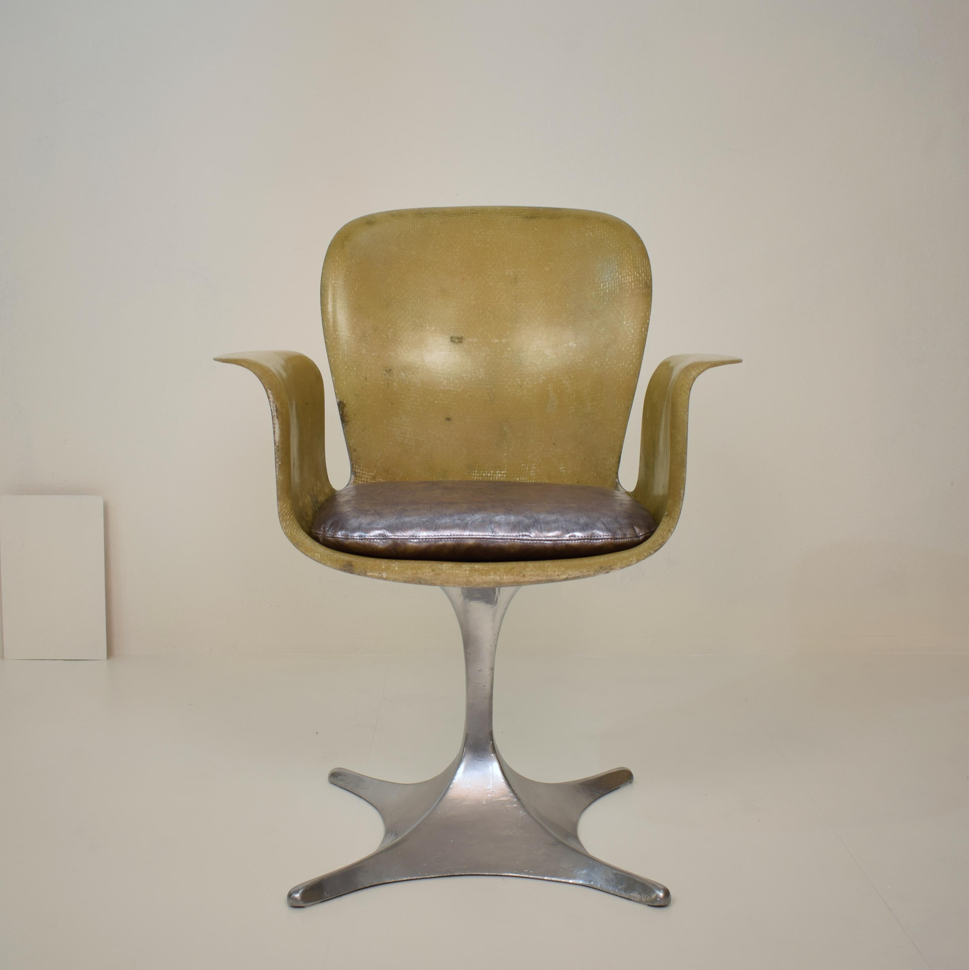 This beautiful and rare midcentury German sculptural fiberglass armchair was made, circa 1957.
It is a prototype and one of a kind.
The chair is handmade and the outside and the base is lacquered in silver. The leather cushion was re-placed.
A