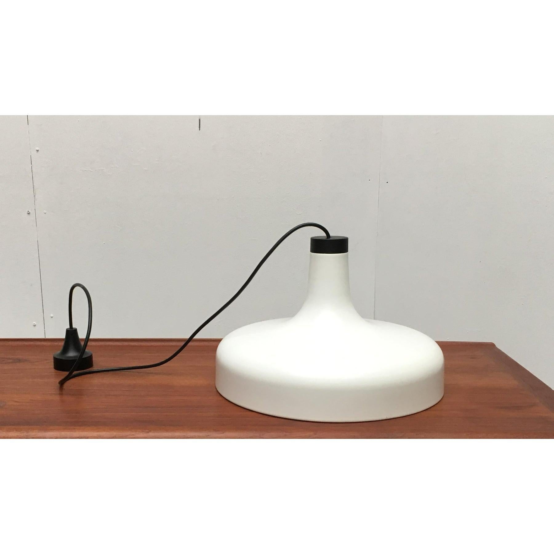 Sleek pendant lamps from the well-known manufacturer Staff Leuchten, Germany.

The shade is tulip-shaped. In the upper part, the lamp is very slim and widens down to full width. The size is particularly impressive. At the bottom, the lights have a