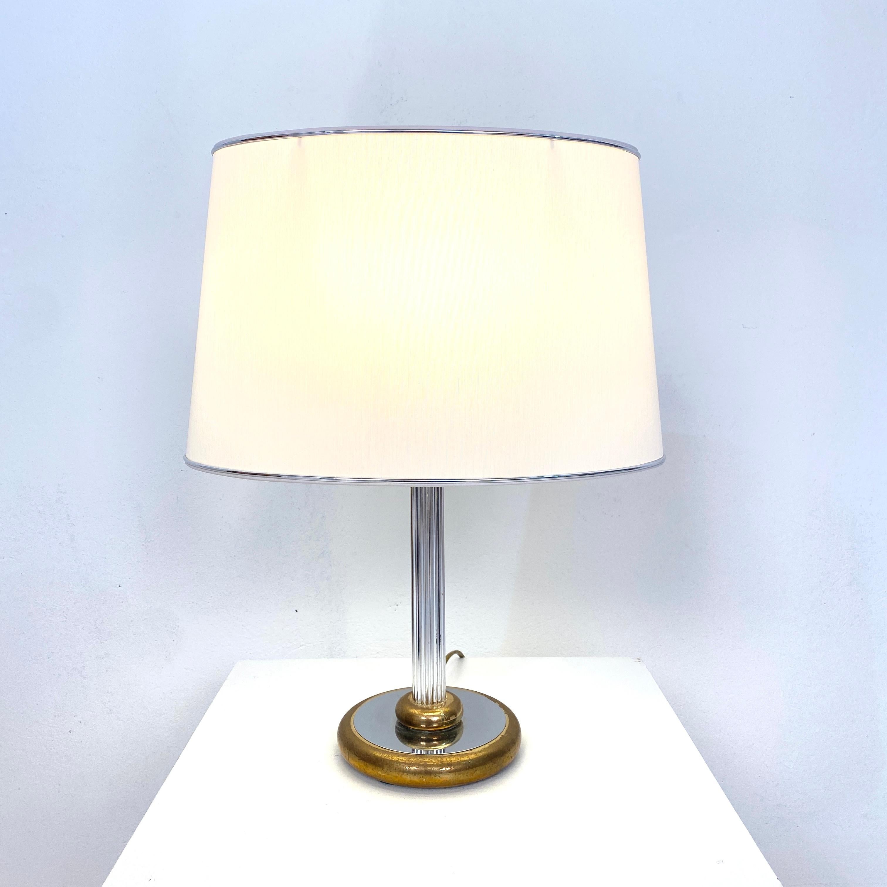 This midcentury table lamp was made by Aro-Leuchte in Germany in the 1970s. It is made out of chrome and brass. The lamp shade is made out of fabric.
There is also a floor lamp in one of my other offers.
A unique piece which is a great eyecatcher