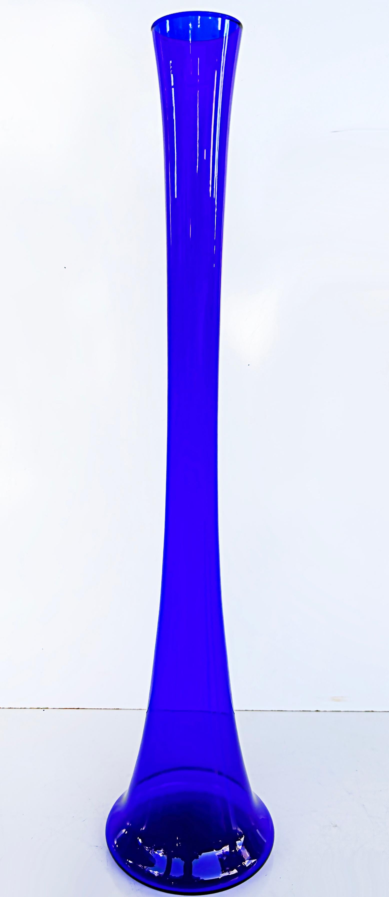 Midcentury German extra tall cobalt blue glass soliflore vase

Offered for sale is a tall midcentury cobalt blue vase that was handblown in the 1960s by Salco Kristallglas of Mundgeblasen Germany. We are calling it cobalt, but you can call it
