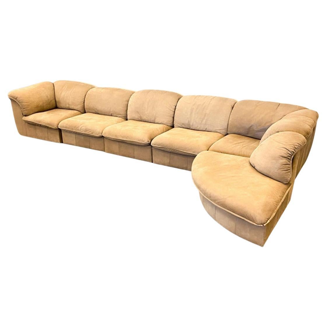 Late 20th Century Mid century German tan suede leather puffy modular sofa by Laauser