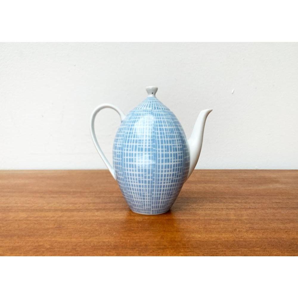 Mid-century German tea or coffee pot by Heinrich Löffelhardt for Arzberg, 1960s This piece has an attribution mark.

Additional information:
Materials: Porcelain
Color: Blue
Styles: Mid-Century Modern
Country of Origin: Germany
Item Type: Vintage,