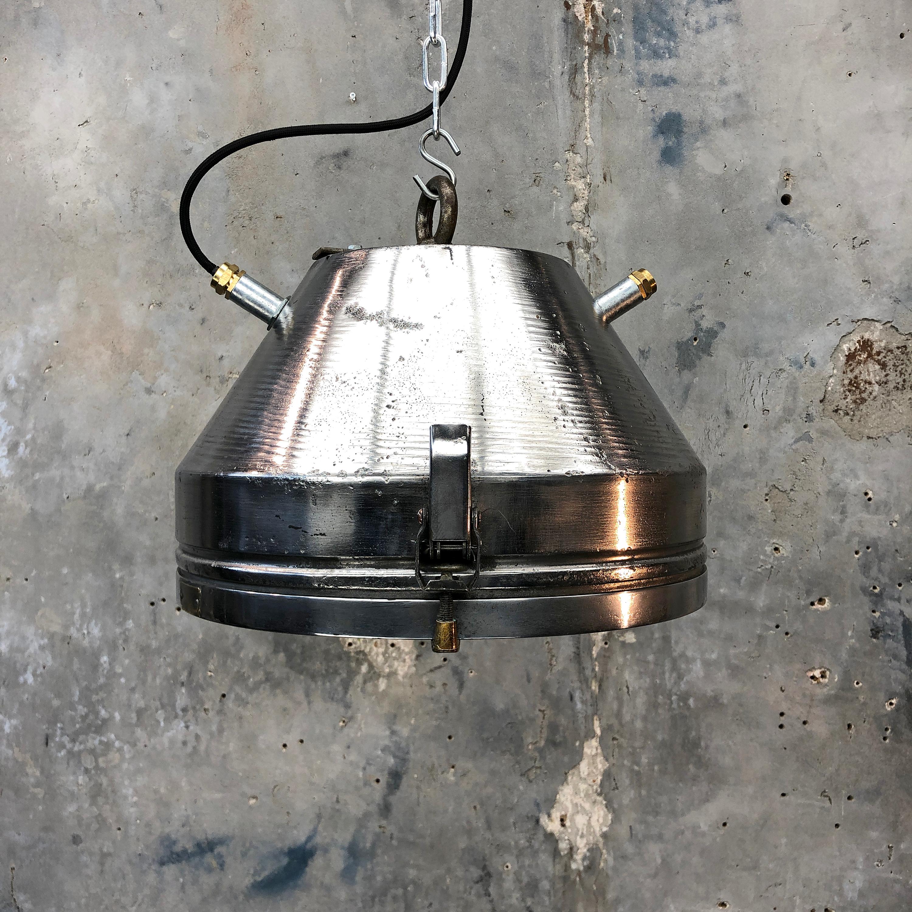 Iron and aluminium ceiling pendant with glass cover by VEB of Germany.

Reclaimed from Industrial settings then professionally restored in the UK ready for use in modern interiors. 

The main body of the light is spun steel and the glass covered