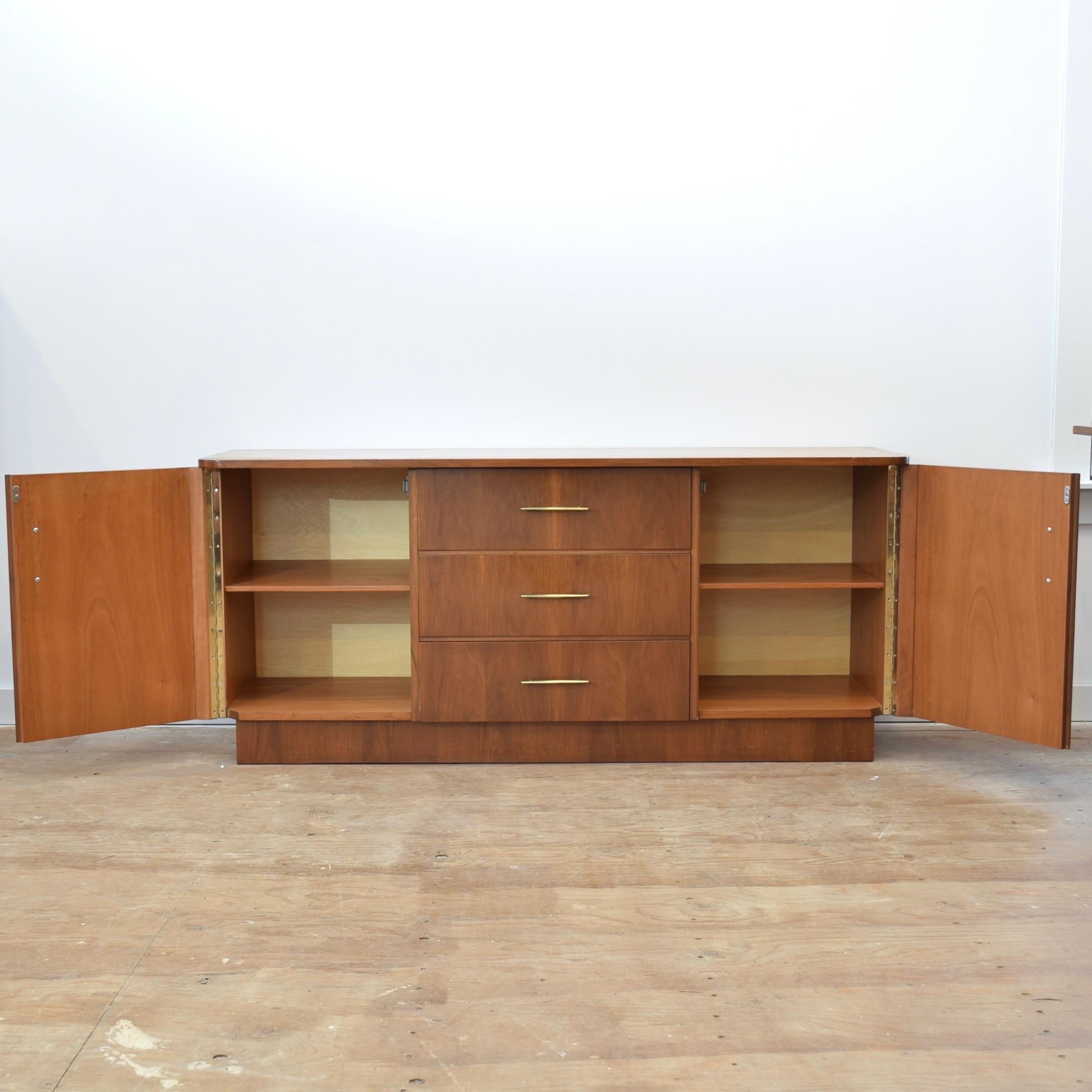 Condition: Excellent Vintage Condition

Dimensions: 59.5” L x 17.5” D x 26.25” H

Description: A vintage walnut sideboard. Custom made by a German cabinet maker, circa 1970s. In excellent condition with great quality construction. 