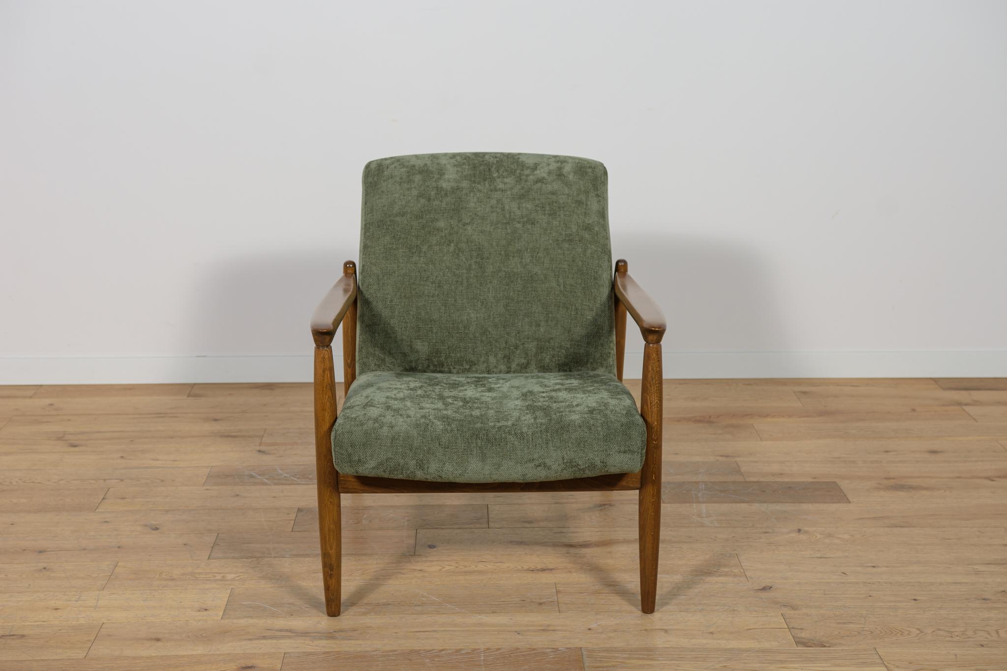  GFM-64 armchair was designed in the 1970s by Edmund Hom. Due to its compact form, full frame and preserved geometry, the armchair is a light piece of furniture. The style refers to Scandinavian design. The armchair have been fully renovated. Frame