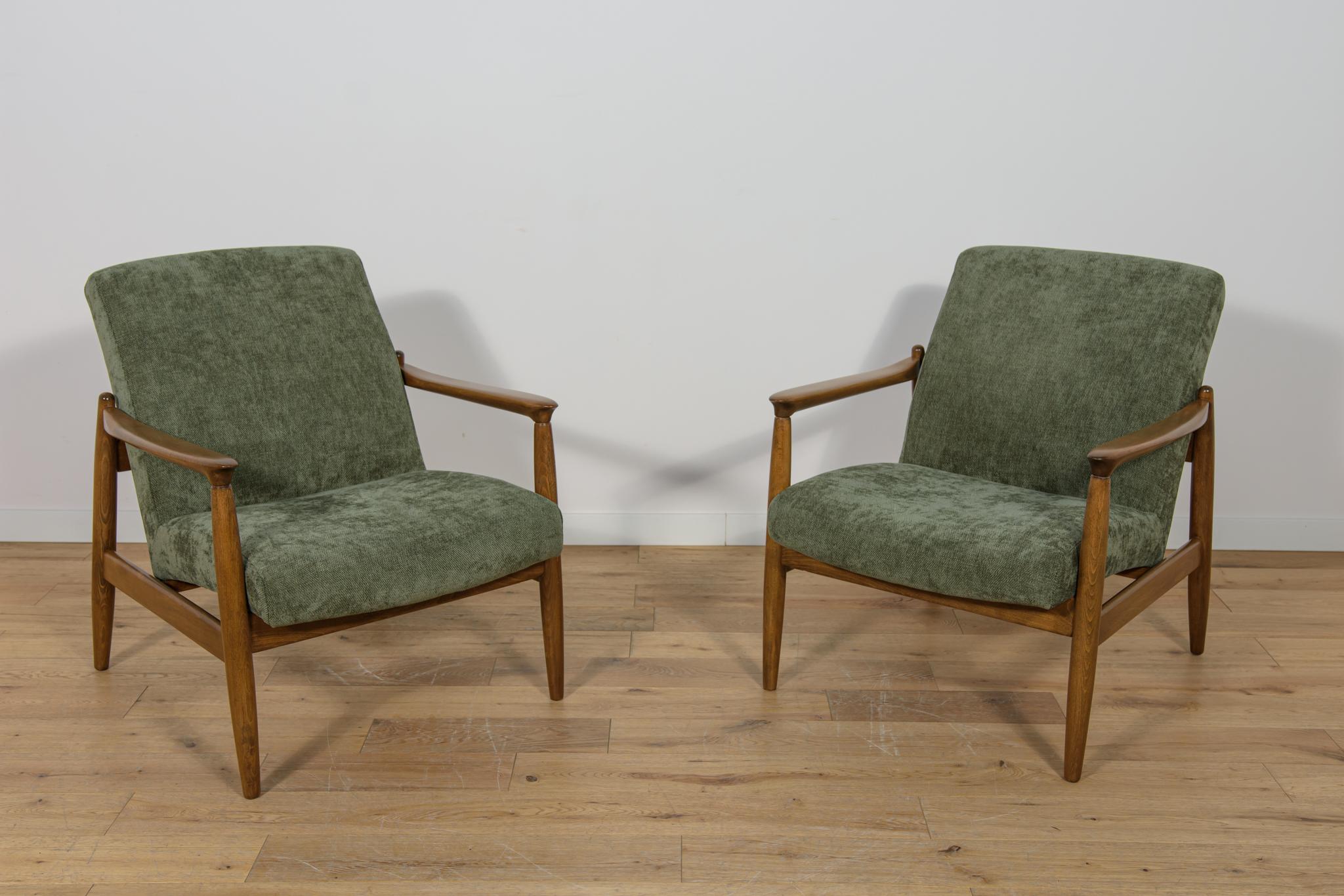 La coppia di poltrone GFM-64 è stata progettata negli anni '70 da Edmund Hom. Grazie alla sua forma compatta, alla struttura completa e alla geometria preservata, la poltrona è un mobile leggero. Lo stile si rifà al design scandinavo. Le poltrone