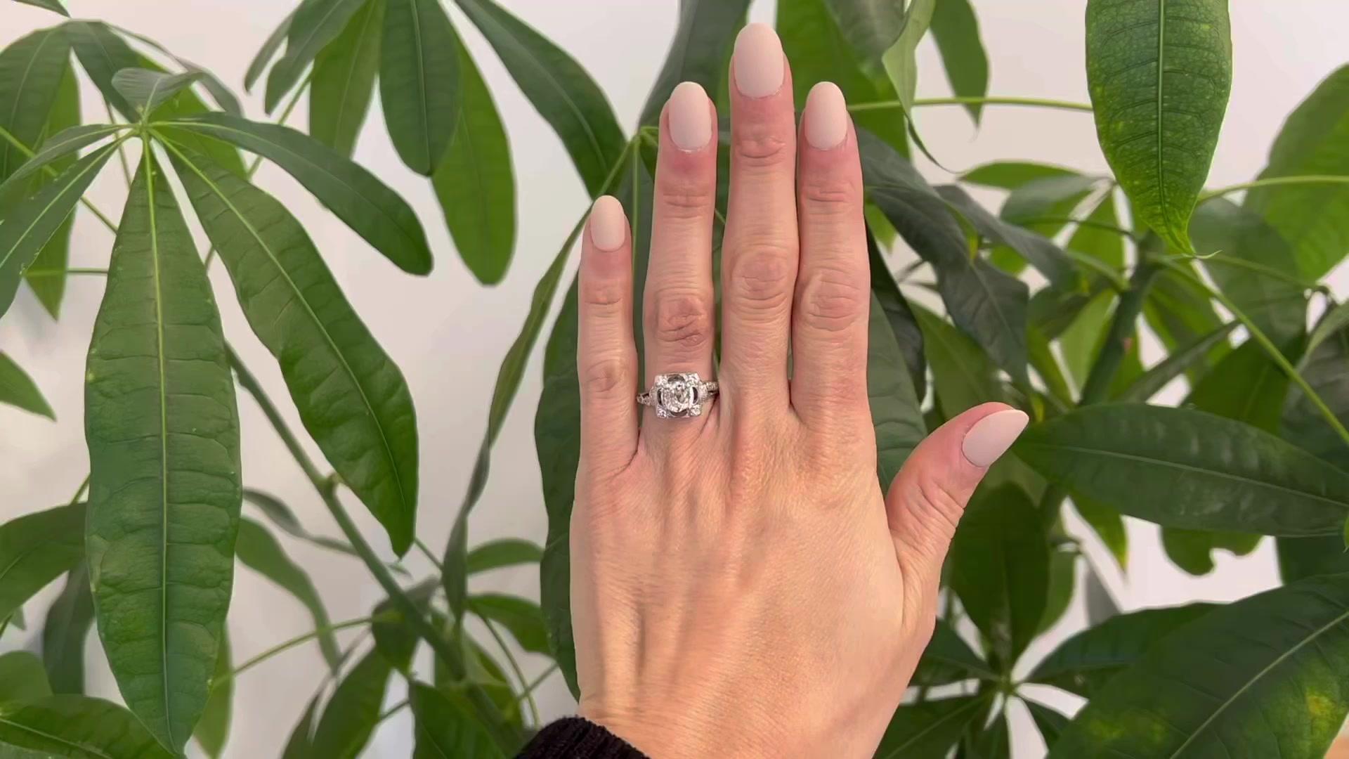 One Mid Century GIA 1.55 Carats Old Mine Cut Diamond Platinum Ring. Featuring one GIA old mine cut diamond of 1.55 carats, accompanied with GIA #2225696679 stating the diamond is L color, I1 clarity. Accented by 16 round brilliant cut and single cut