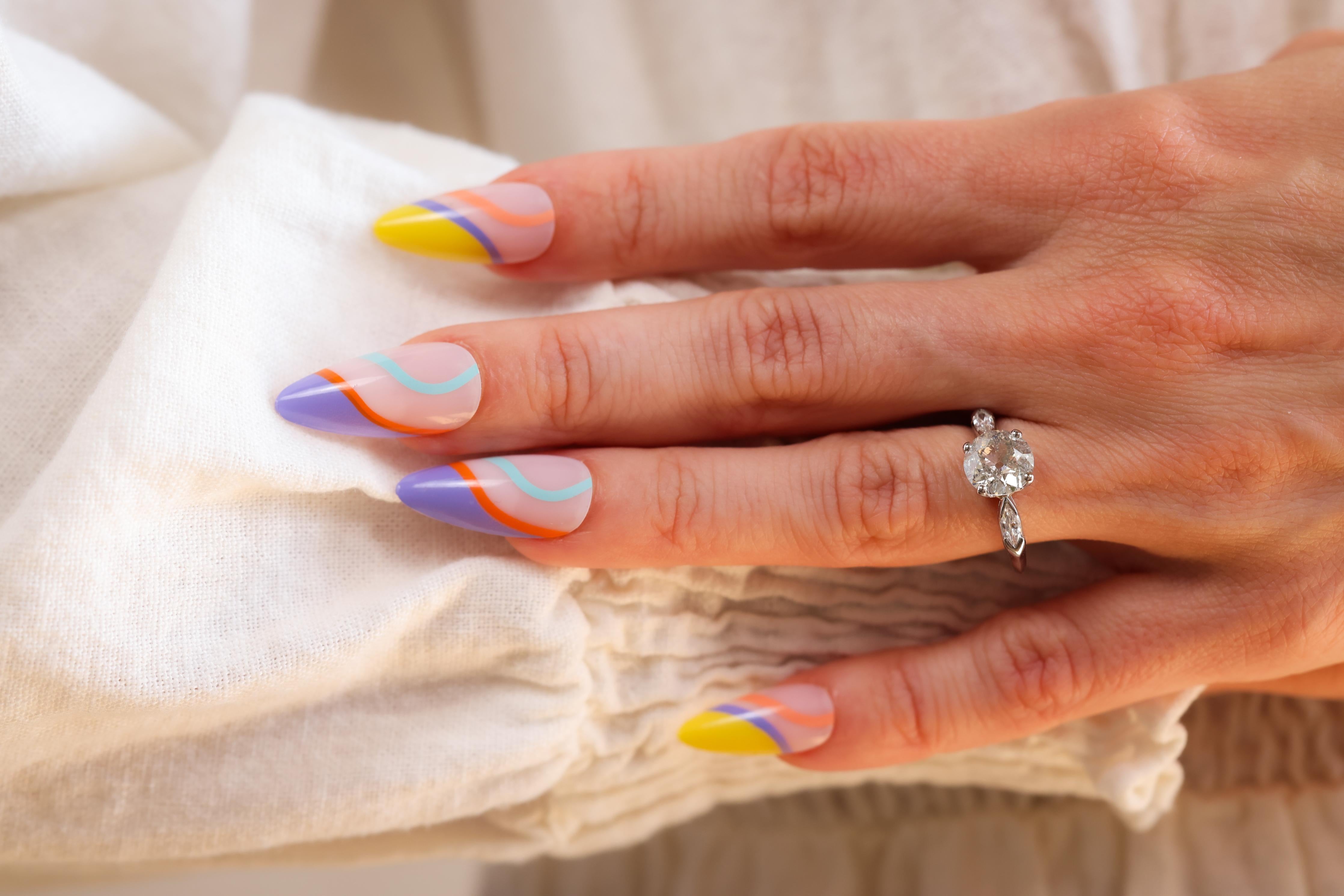Certificate: GIA
Center Stone: Diamond
Cut: Round Old European 
Weight: 1.76 Carats
Color: I
Clarity: I2
Accent Stone: 2 Diamonds
Cut: Marquise
Weight: Approximately 0.30 Carats
Color: F-G
Clarity: VS
Metal: Platinum
Era: Mid-Century
Circa: