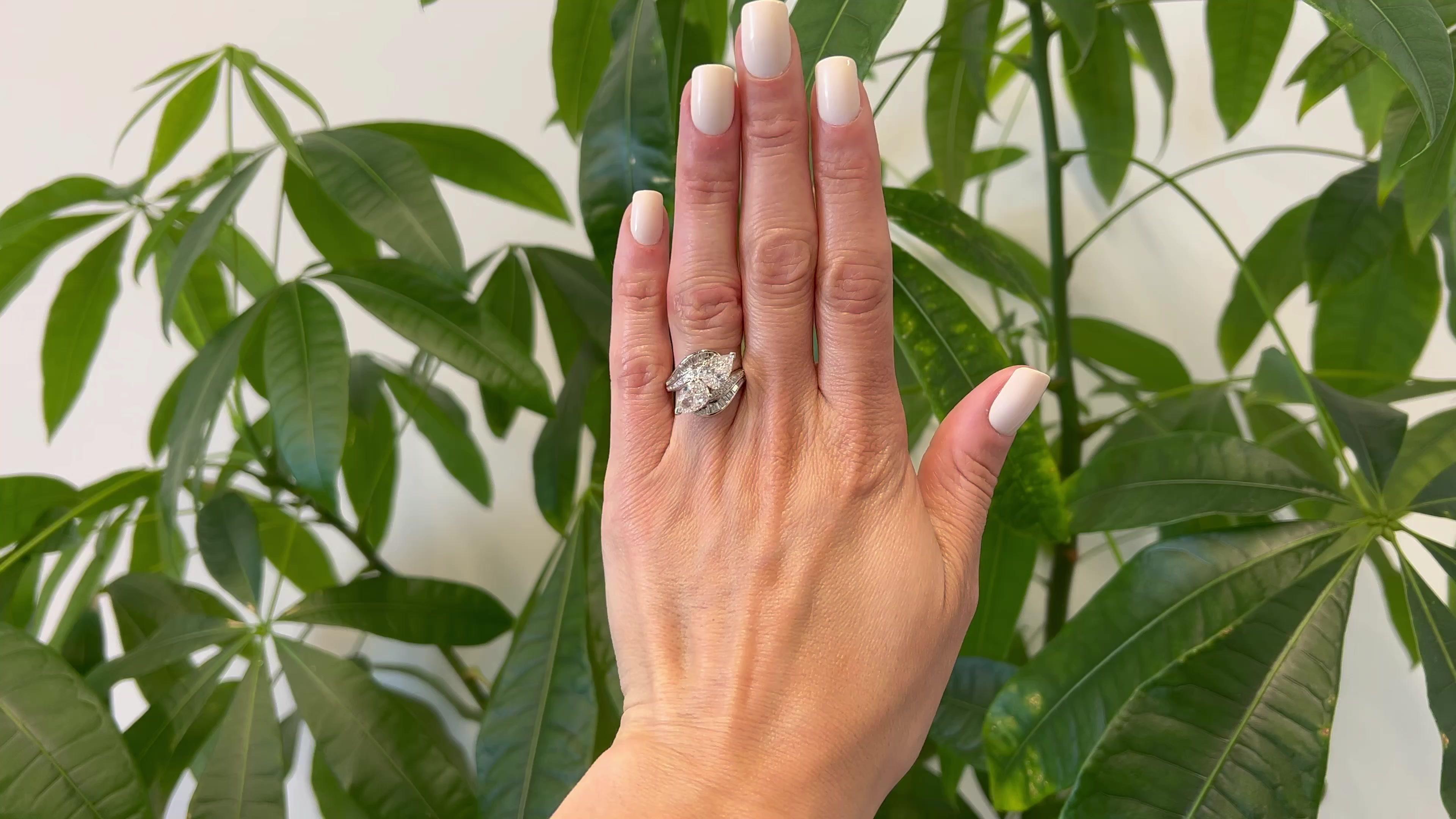One Mid Century GIA 2.53 Carat Total Weight Pear Cut Diamond Platinum Toi et Moi Ring. Featuring one GIA pear cut diamond of 1.28 carats, accompanied with GIA #5221999332 stating the diamond is D color, SI1 clarity, and one GIA pear cut diamond of