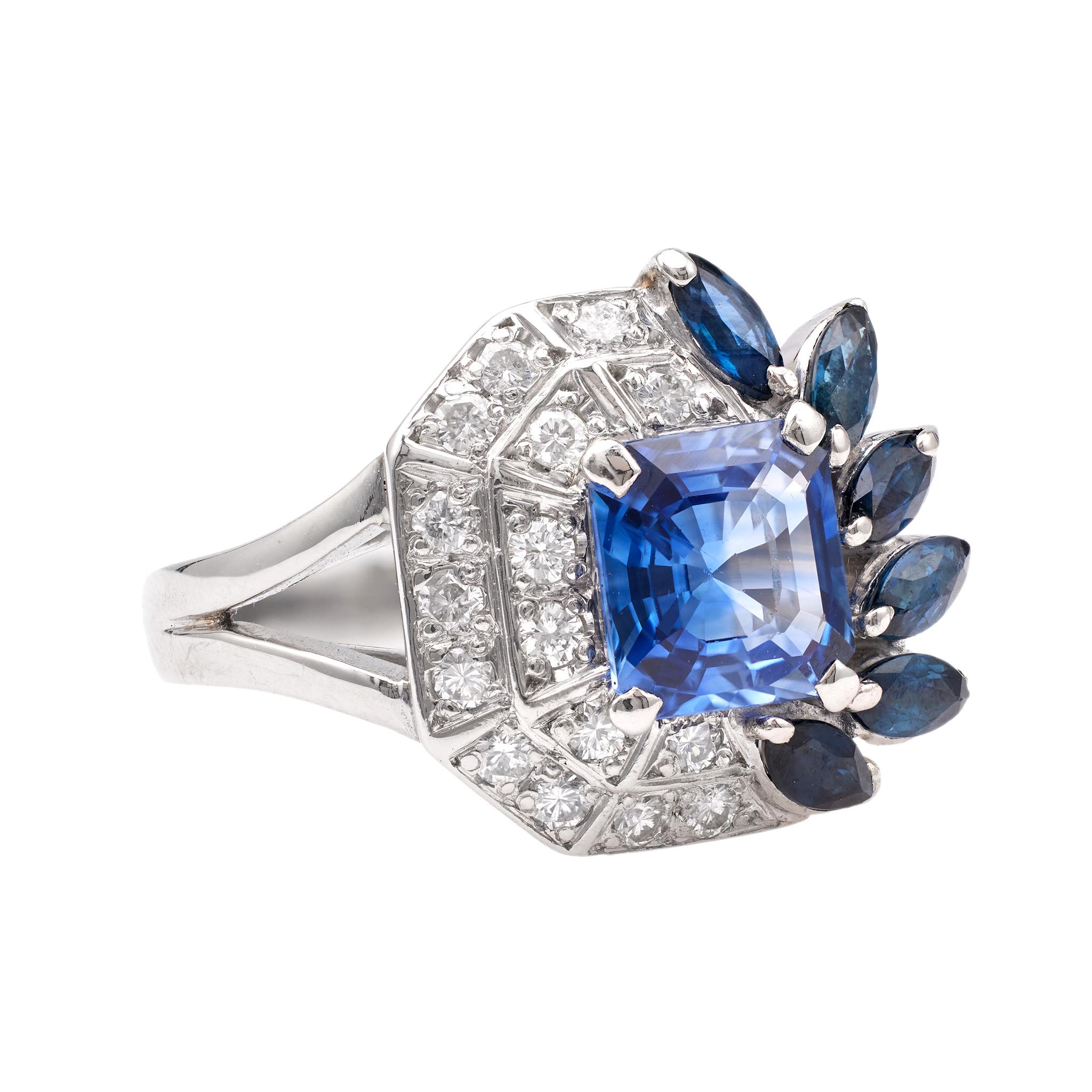 One Mid-Century GIA Madagascan No Heat Sapphire Diamond Platinum Ring. Featuring one square mixed cut sapphire weighing approximately 1.65 carats, accompanied by GIA #2231178008 stating the sapphire is of Madagascan origin and has no indications of