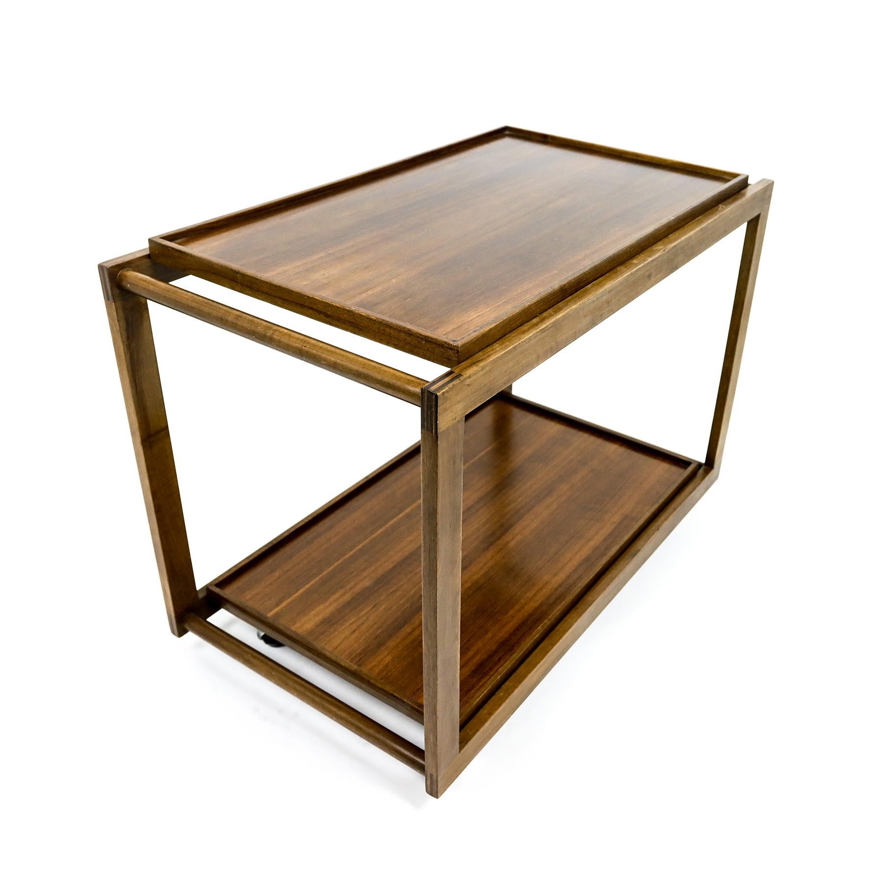Mid century walnut bar cart, or serving trolley, by Gianfranco Frattini for Cassina with two removable solid wood trays.

Architect and designer Gianfranco Frattini was one of the most important Italian designers of the 20th Century. During his